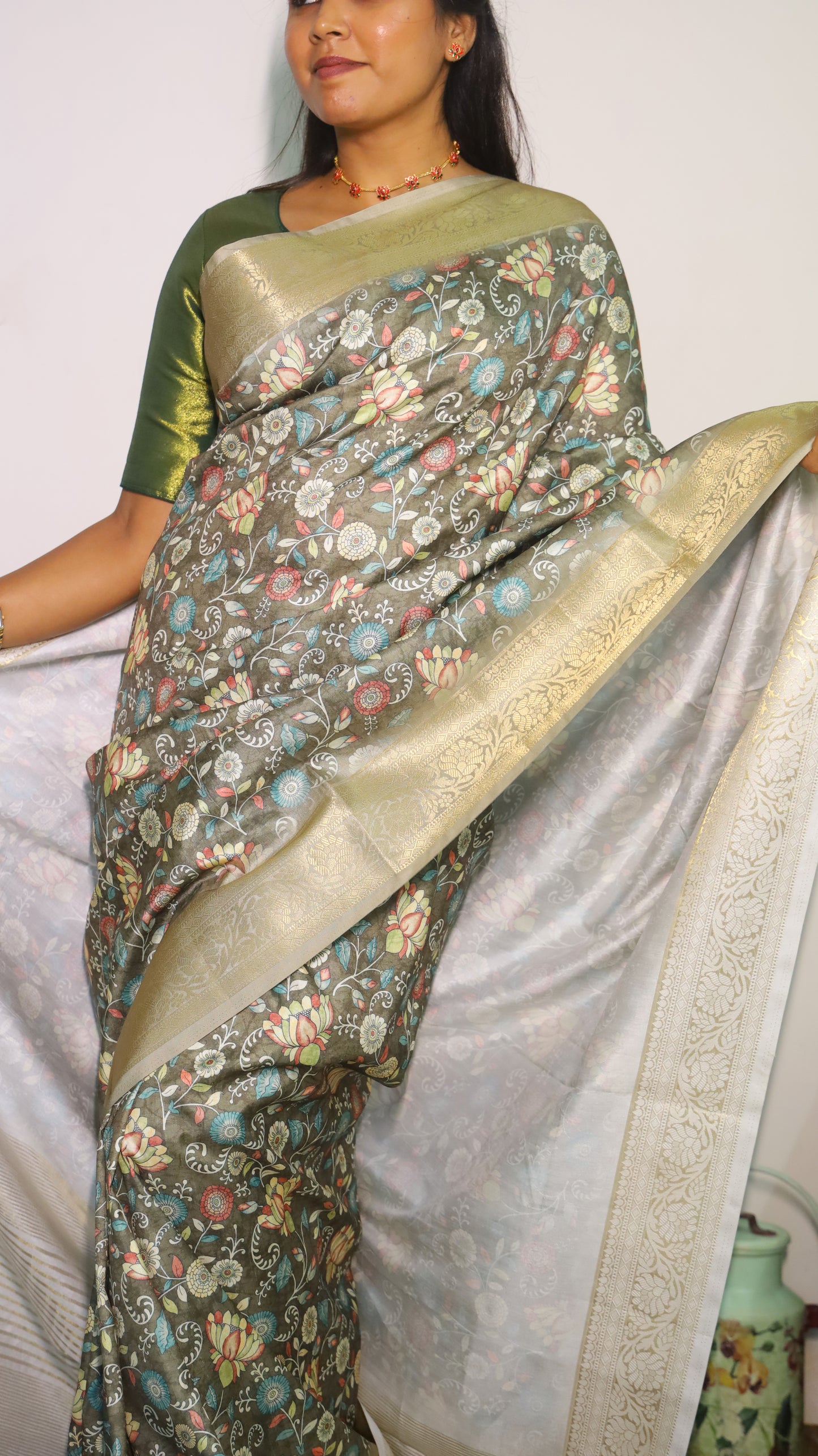 Elegant Kalamkari Design Semi Silk Cotton Saree with a light green floral body with gold zari border - VEDHIKA