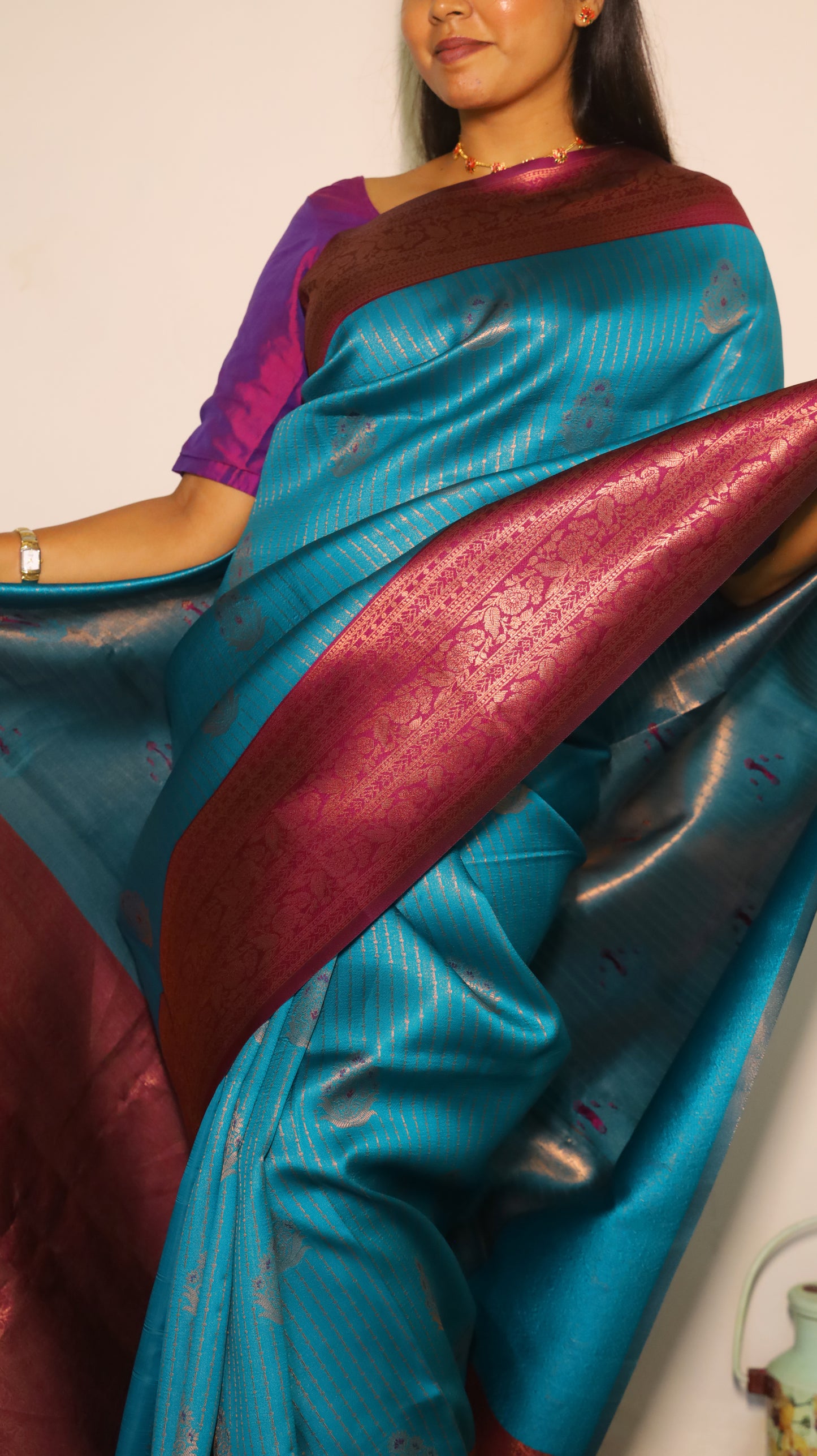 Luxurious semi soft silk saree in peacock green and purple border with gold zari - AVANTHIKA