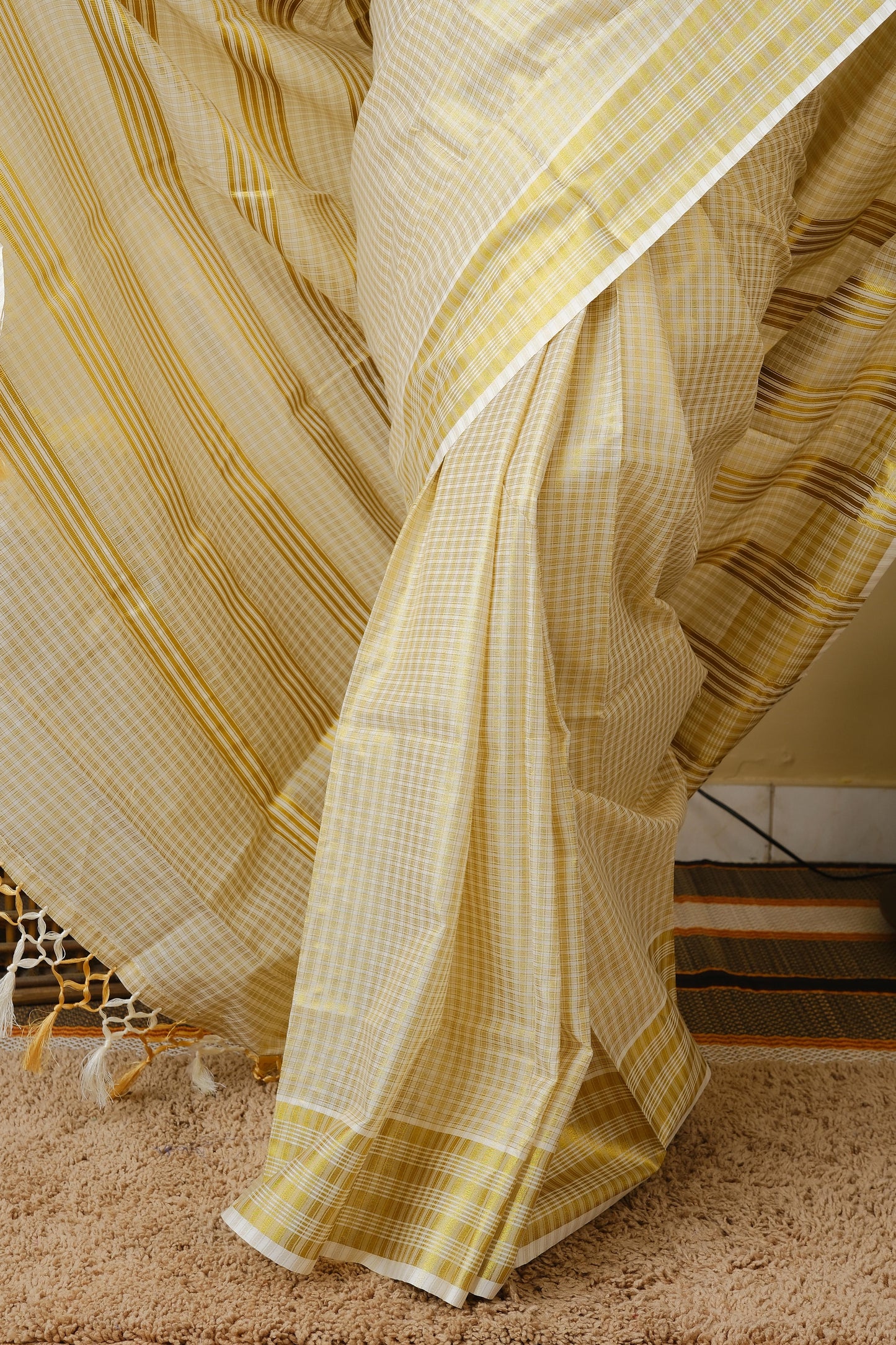 Onam kasavu silk in cream with all over checks in gold zari - AVANTHIKA