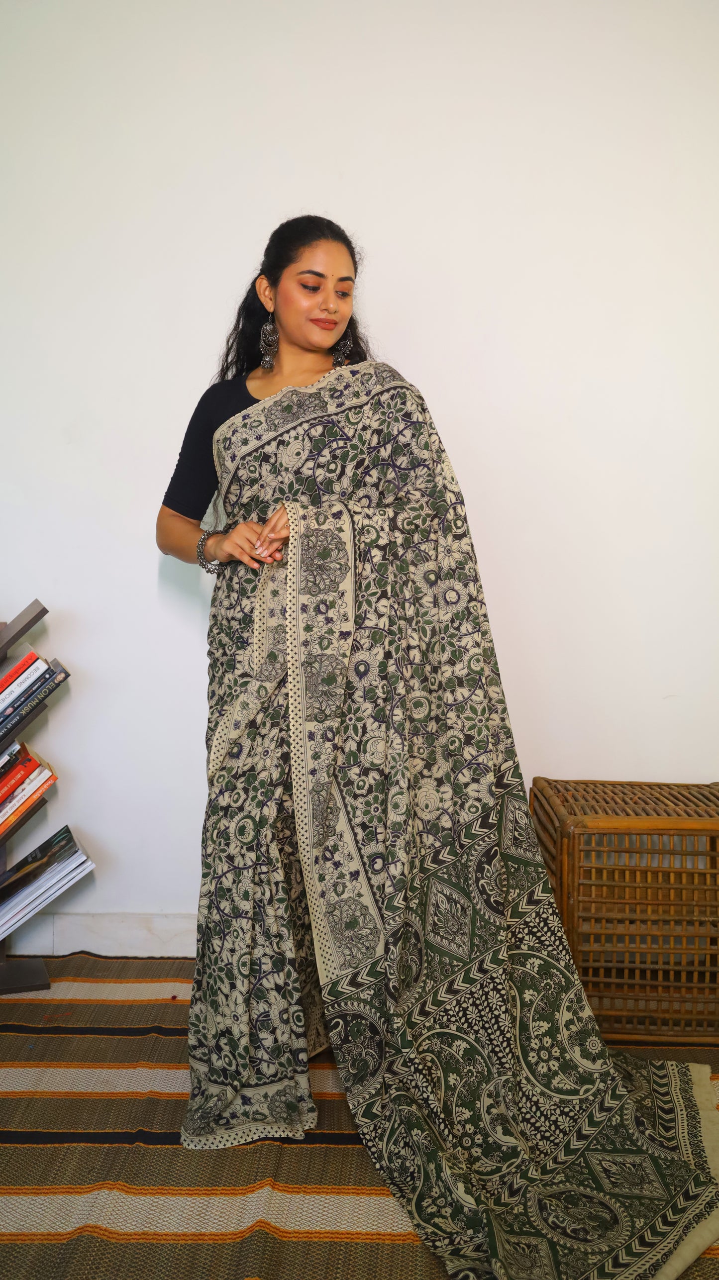 Artisanal black base kalamkari cotton saree with delicate beige, green and blue motifs blossoming - BOOMIKA