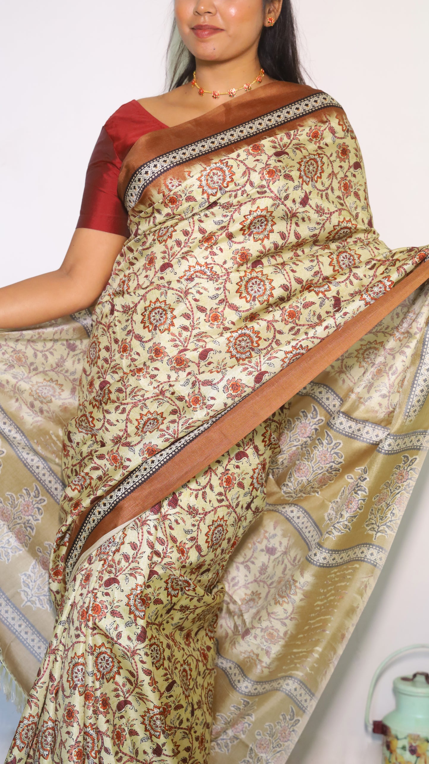 Sophisticated soft silk designer saree in cream and maroon with intricate floral motifs - AVANTHIKA