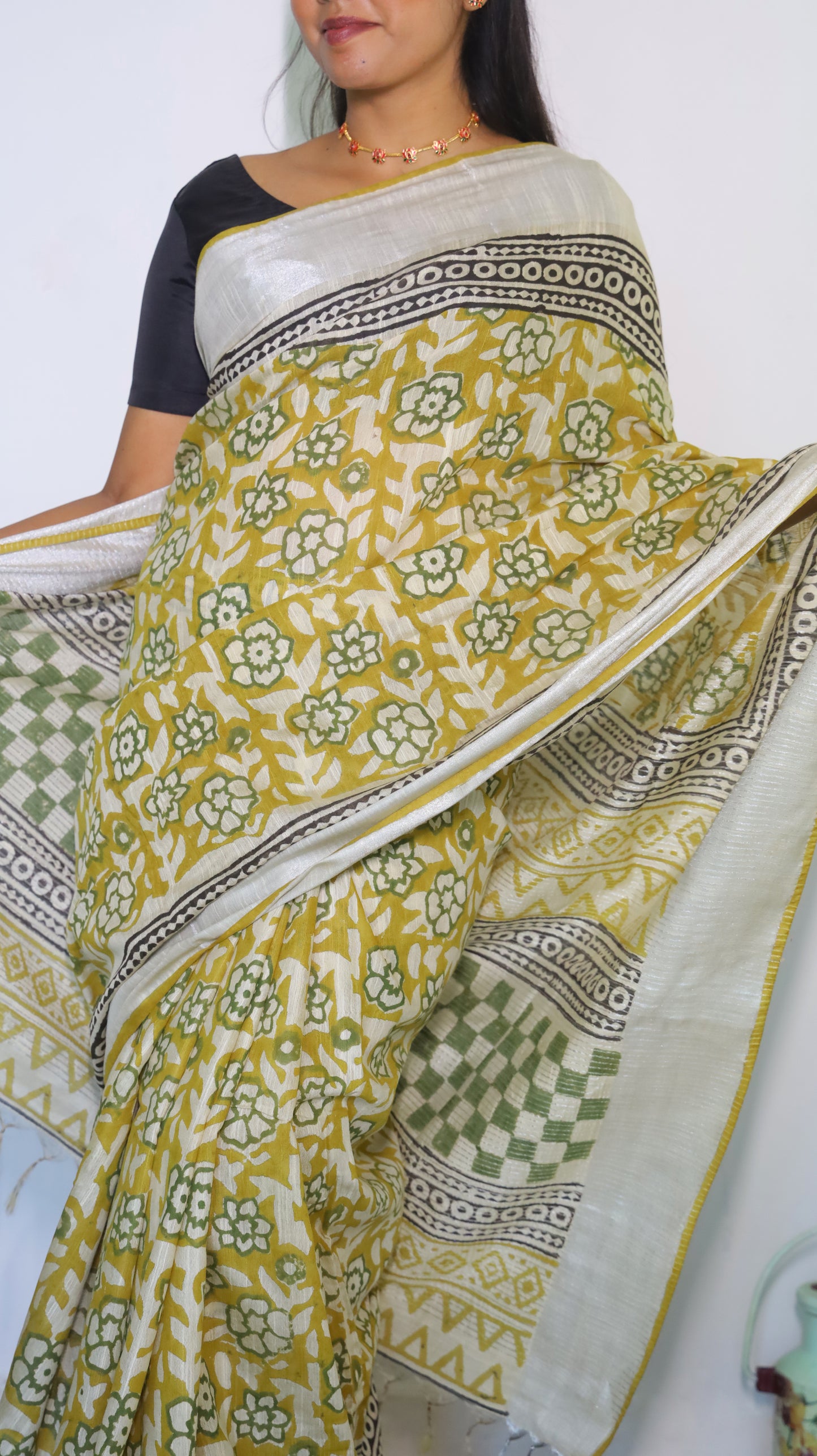 Artisanal white chanderi silk cotton saree with bagru-inspired block prints in mustard, green, and black - VEDHIKA