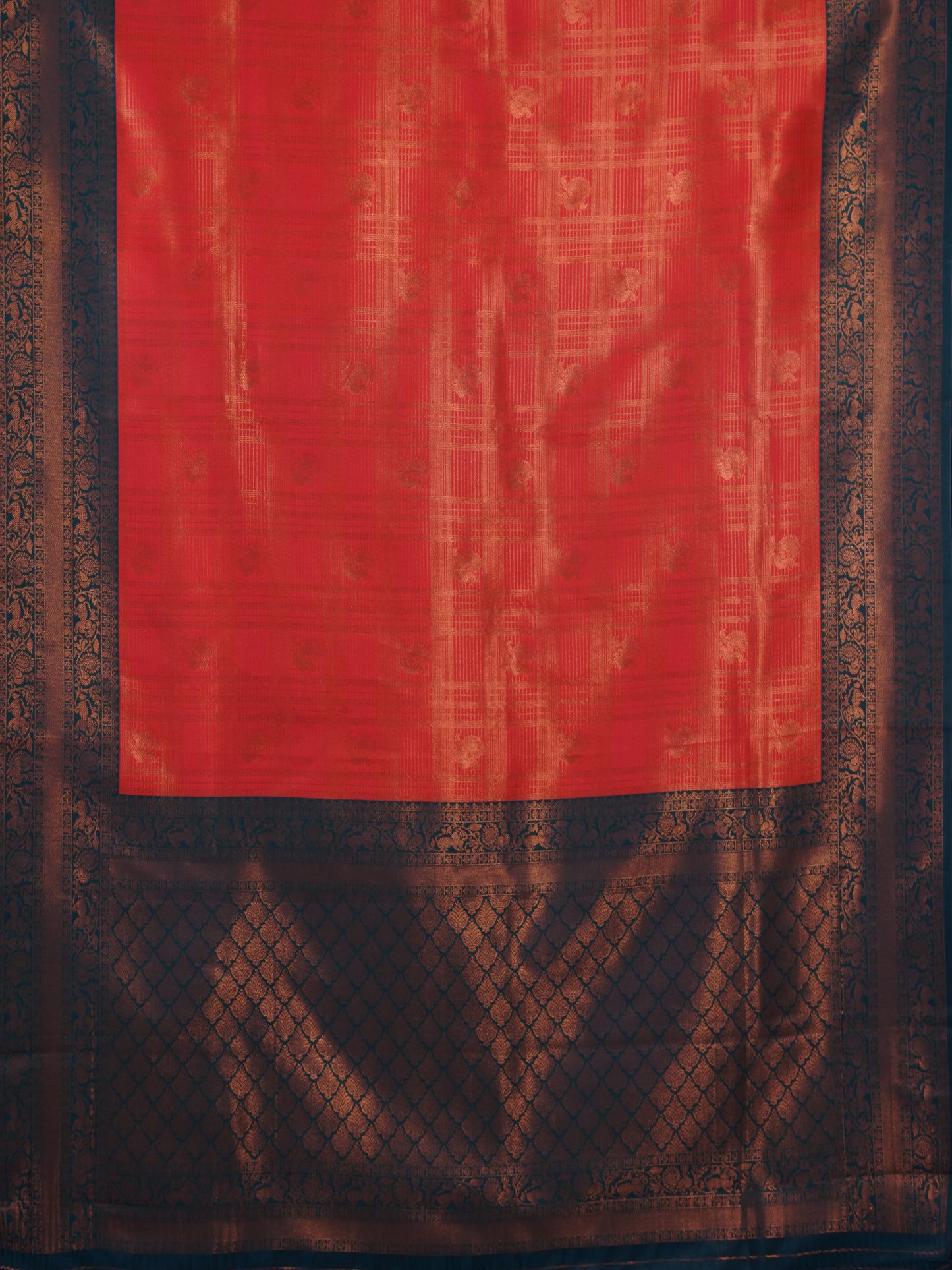 Luxurious soft silk red tissue saree with self imprint and bottle green border with gold zari - AVANTHIKA