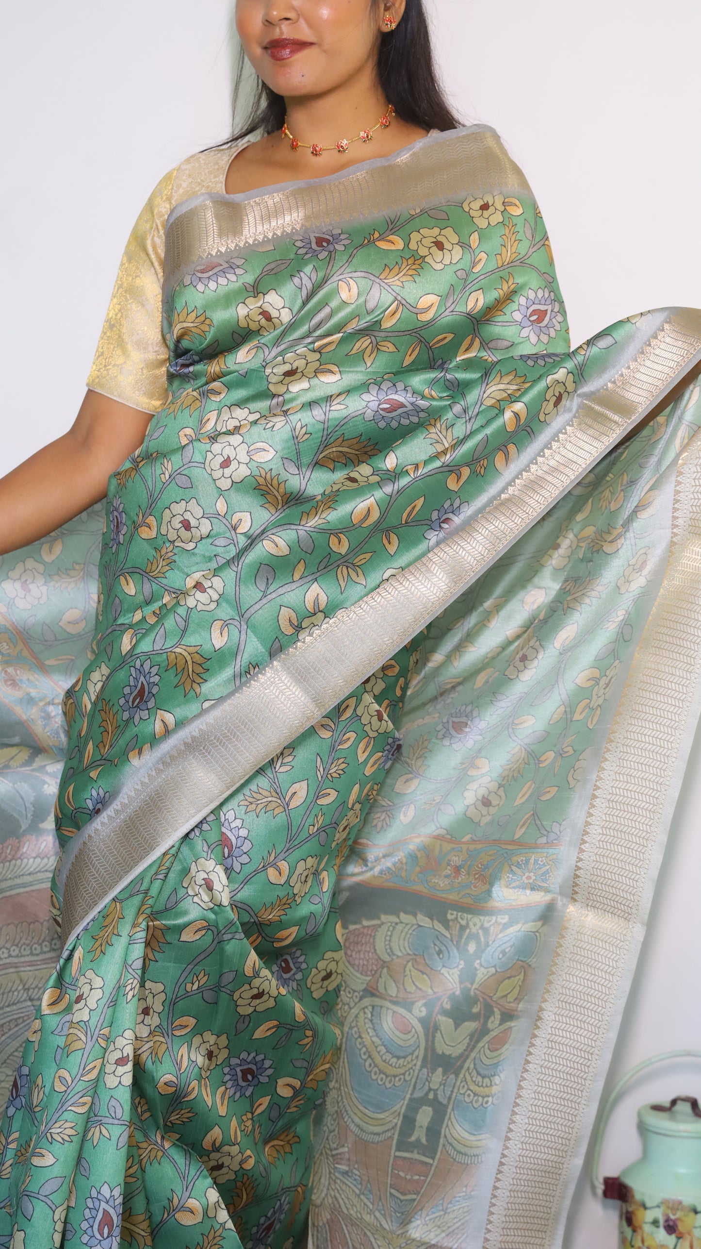 Graceful Kalamkari Semi Silk Cotton Saree with a light green body and dark green pallu with an elegant satin border - VEDHIKA