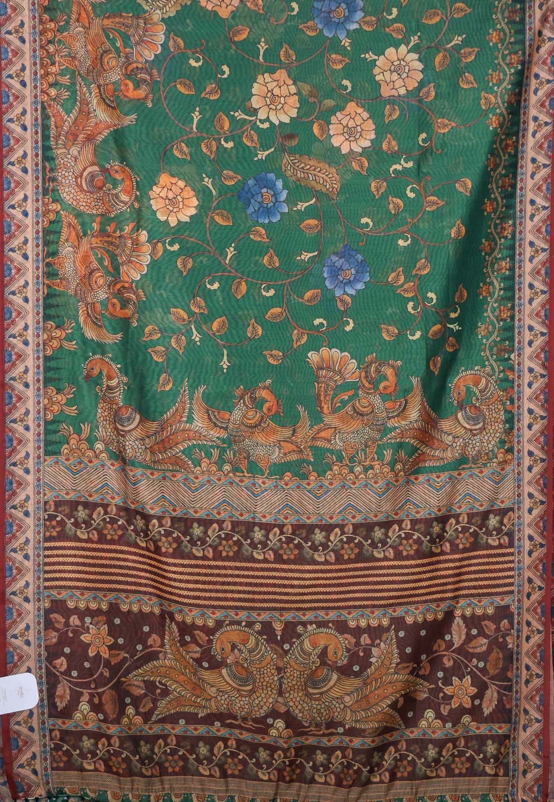 Exquisite deep bottle green silk cotton saree with floral and peacock motifs, paired with a maroon border - VEDHIKA