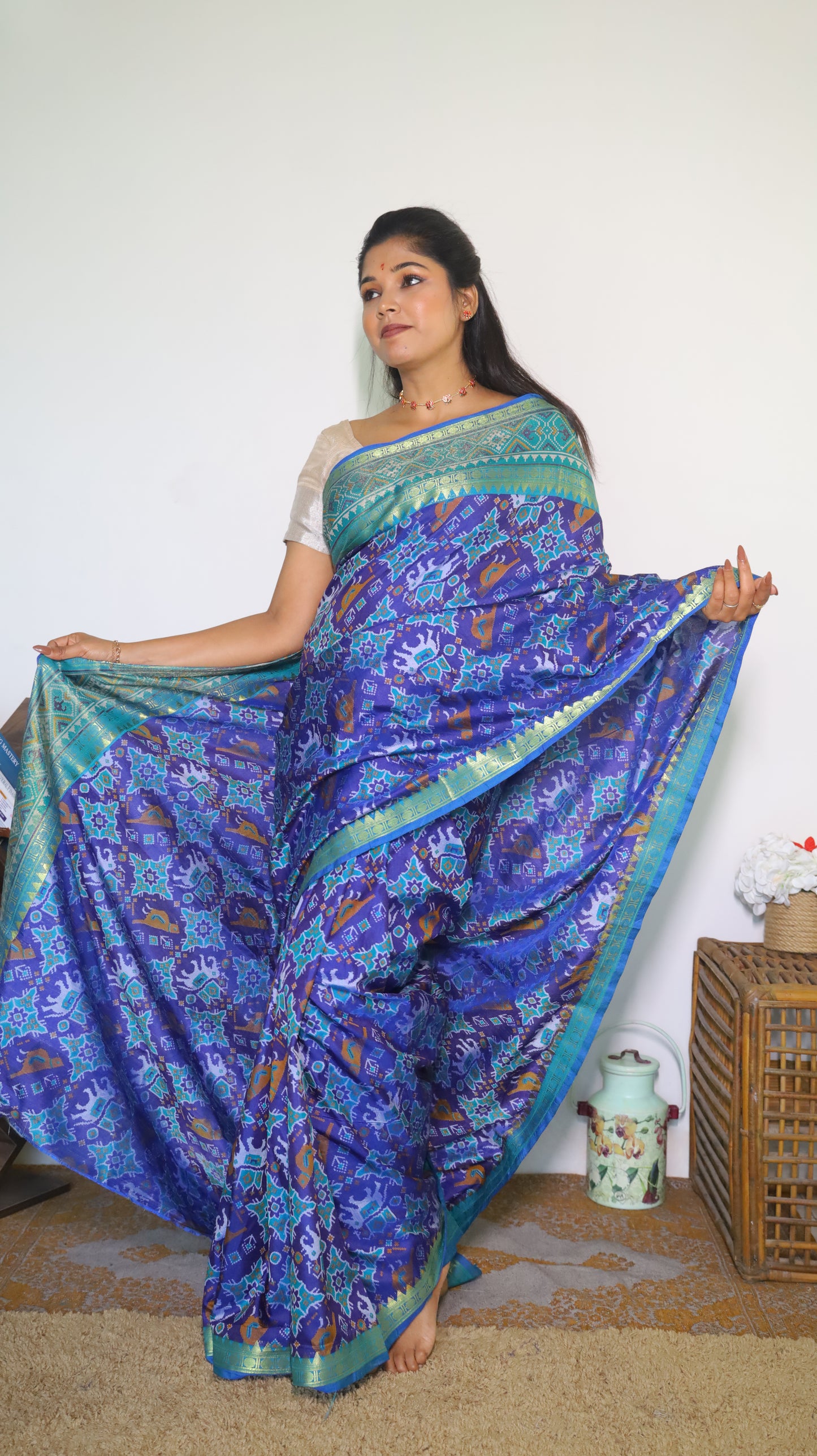 Stunning semi silk saree in blue with vibrant Patola prints with intricate border - VEDHIKA