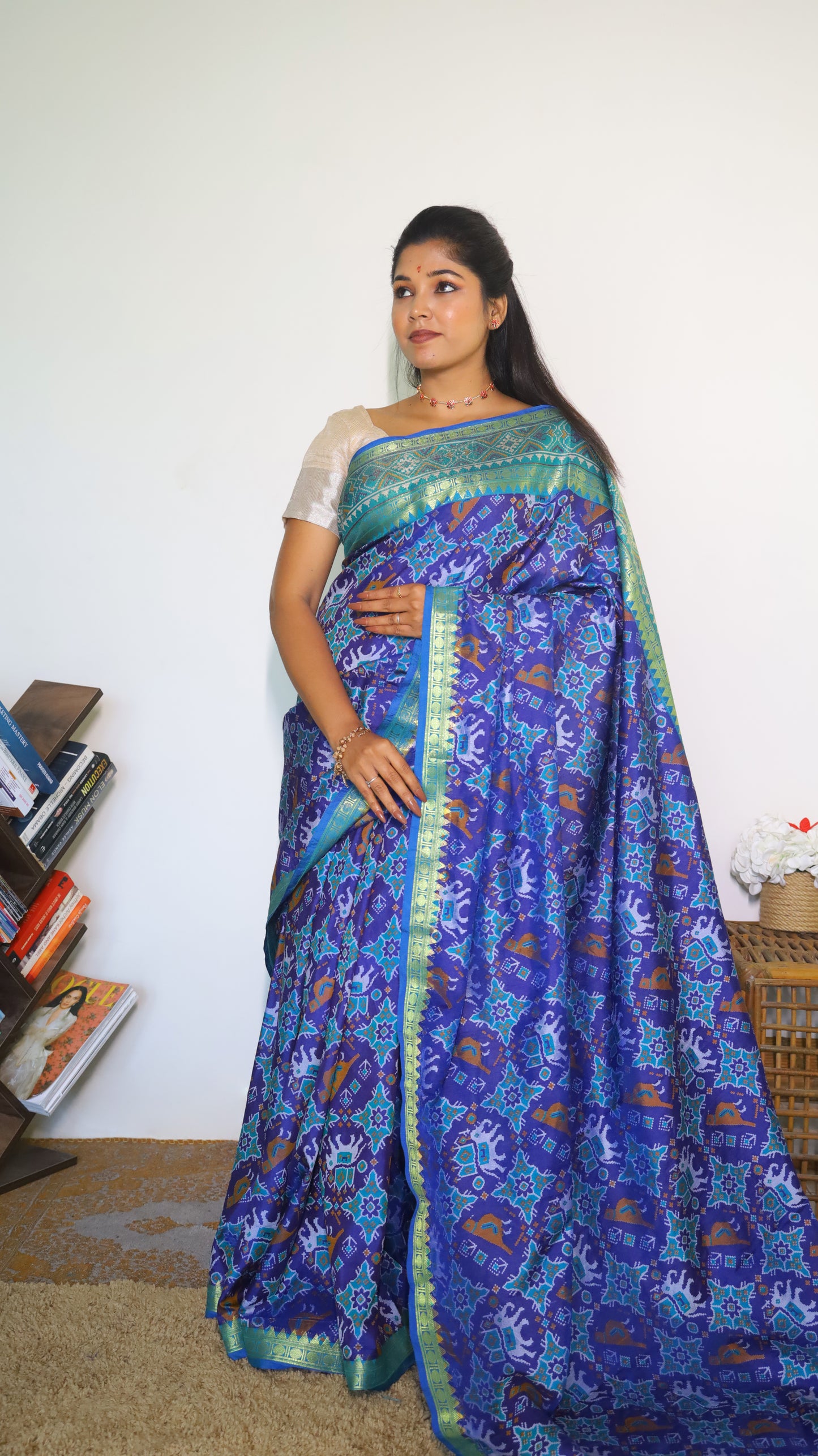 Stunning semi silk saree in blue with vibrant Patola prints with intricate border - VEDHIKA