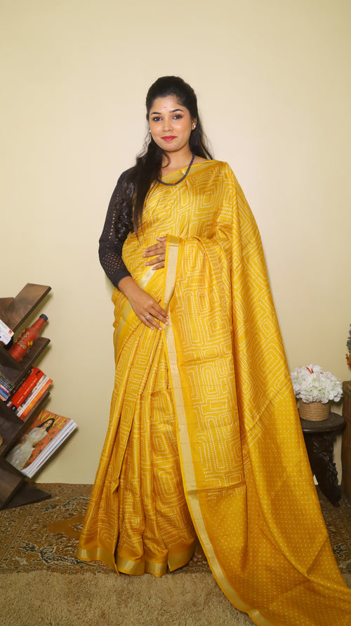 Turmeric gold semi silk saree with its intricate white dotted body, perfect for casual wear - SHRUTHIKA