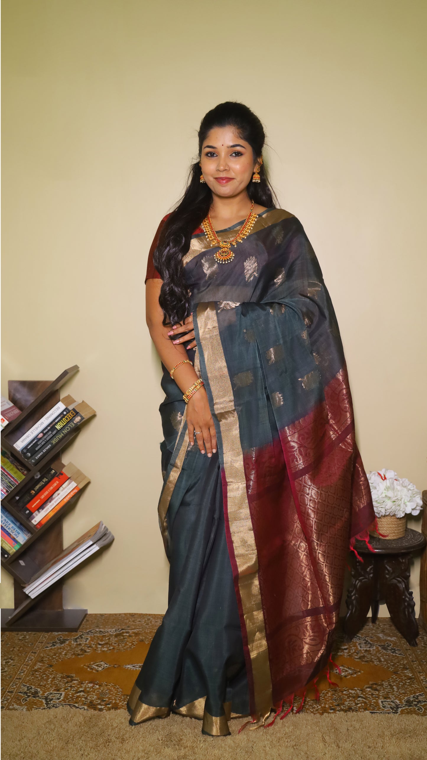 Striking Wine red and dark green meet soft silk in this traditional, handwoven floral motif saree - SWASTHIKA