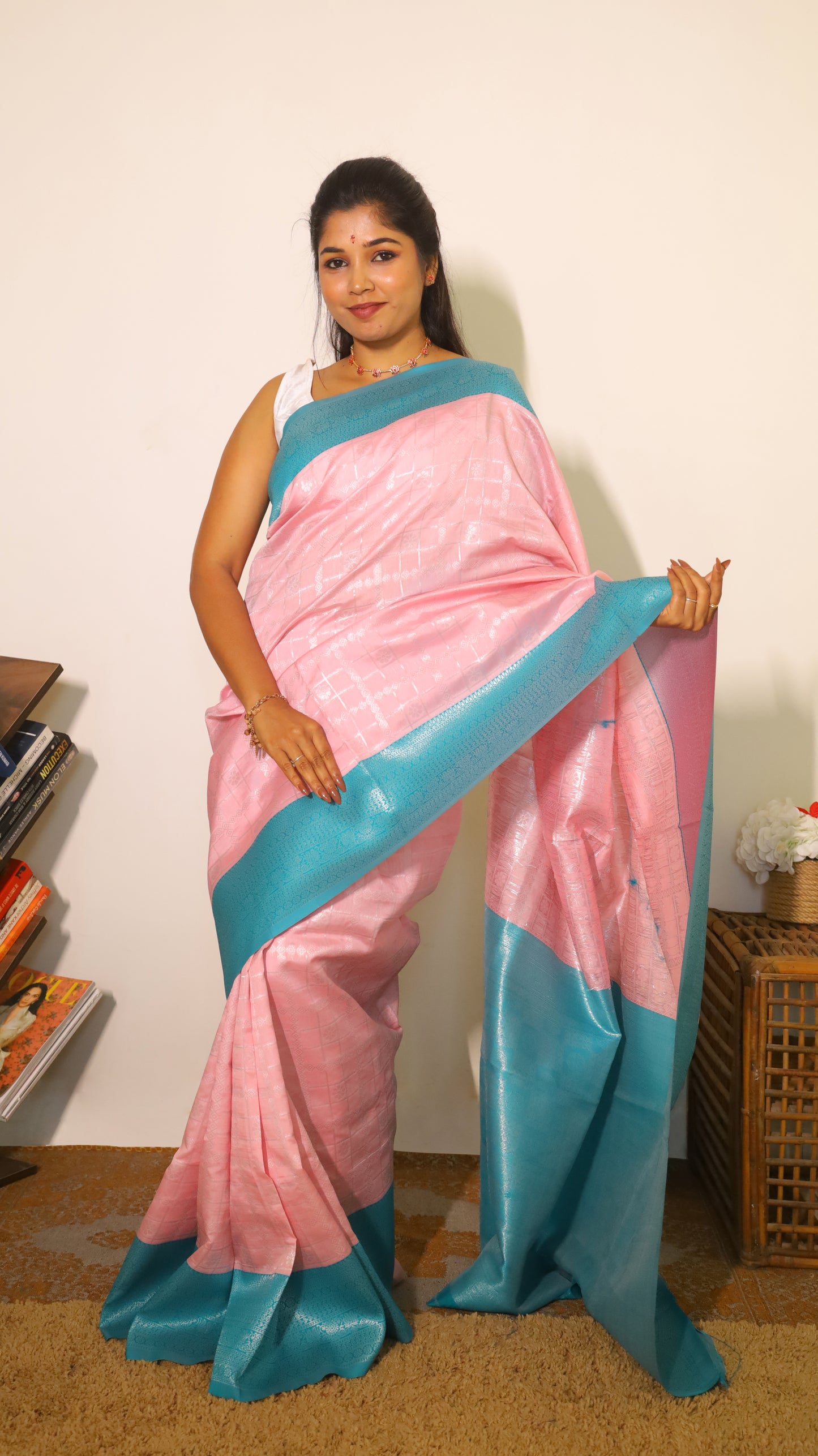 Refined pastel pink soft silk saree highlighted with a striking turquoise blue border and pallu - Avanthika