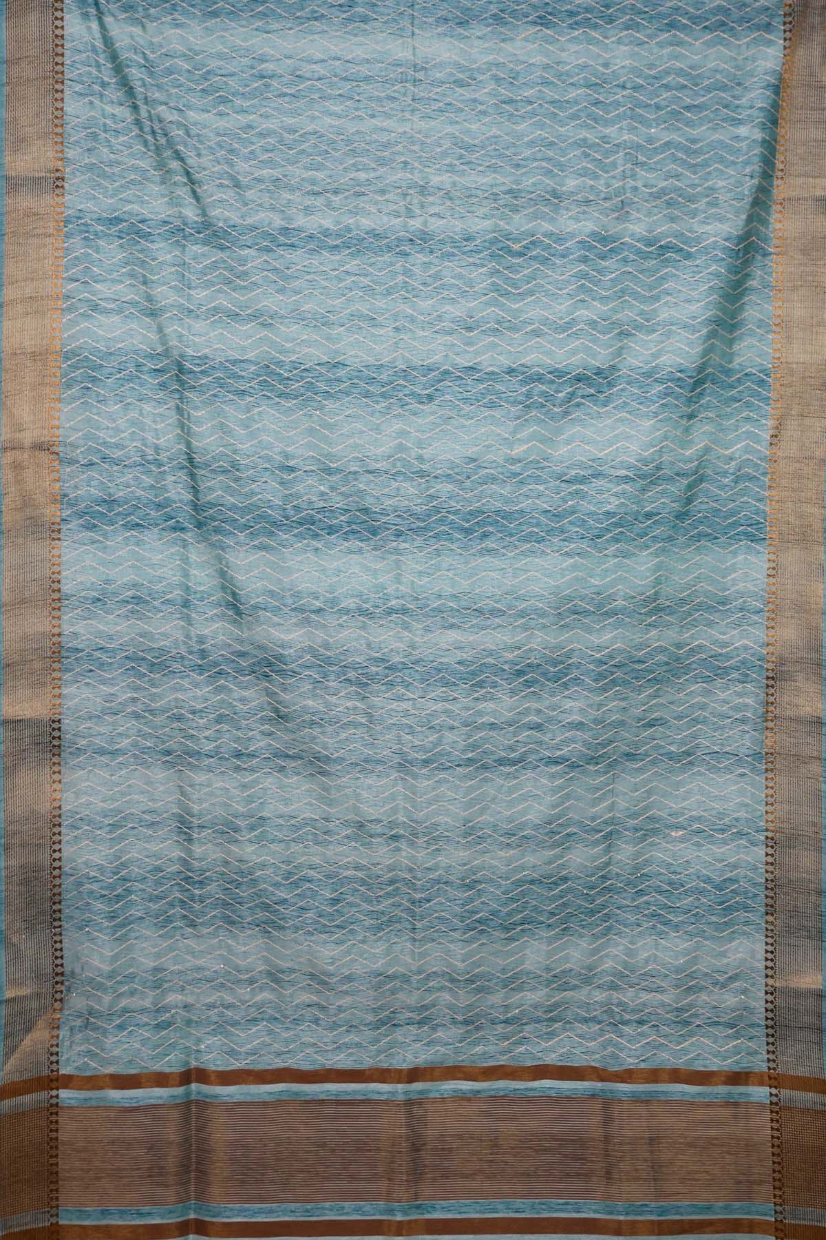 Elegant bright and breezy, this turquoise blue saree with an earthy dull gold border. Perfect for poojas, or gifting - PREETHIKA