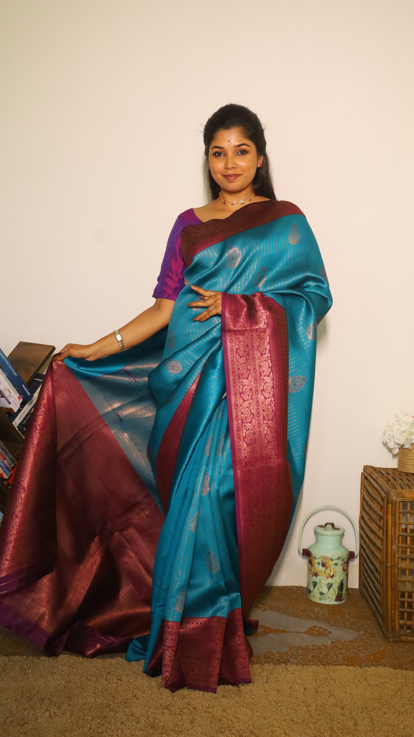 Luxurious semi soft silk saree in peacock green and purple border with gold zari - AVANTHIKA