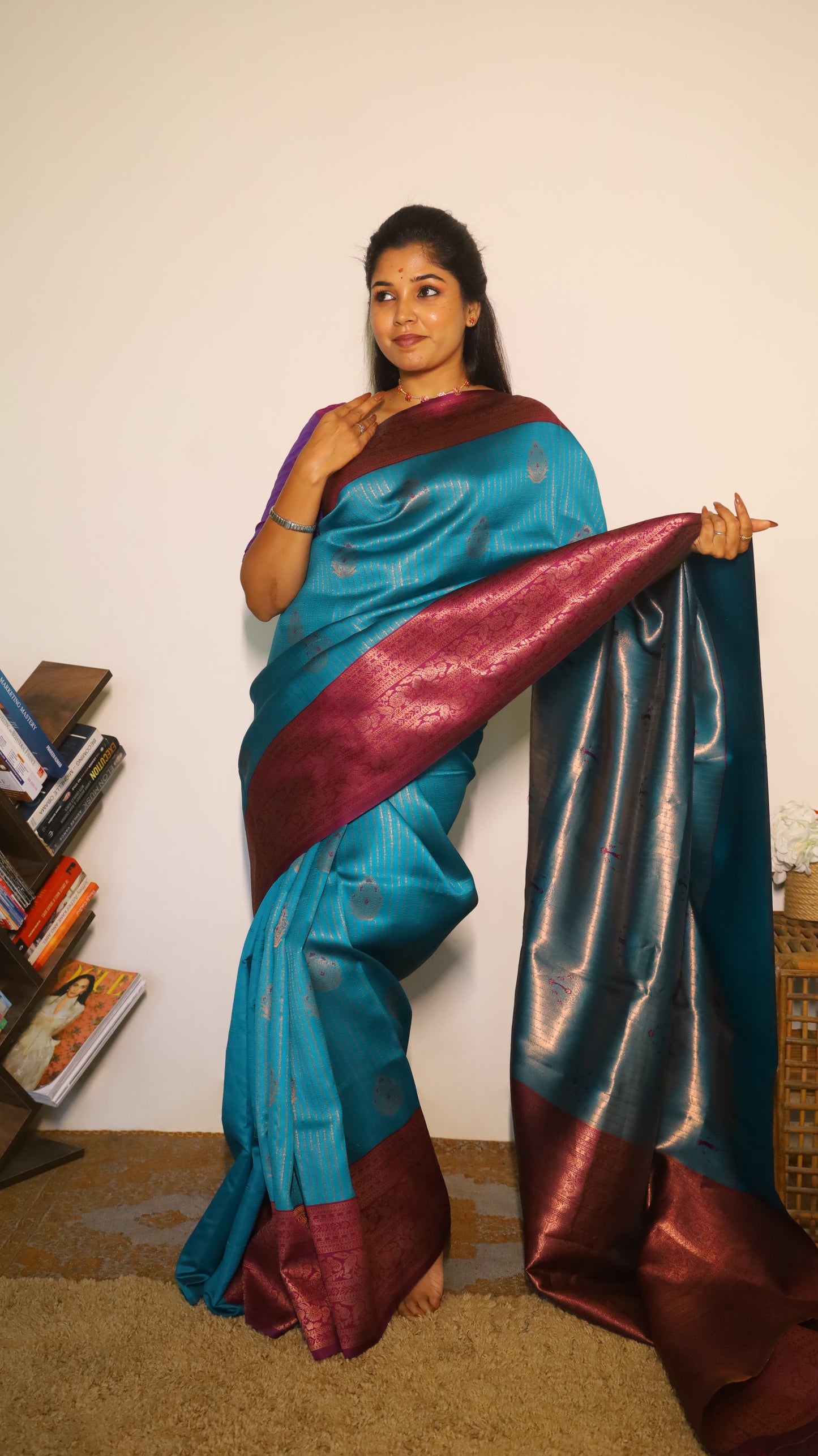 Luxurious semi soft silk saree in peacock green and purple border with gold zari - AVANTHIKA