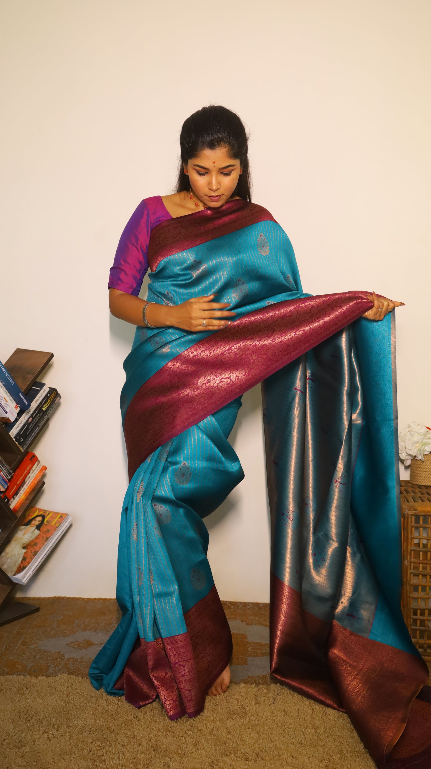 Luxurious semi soft silk saree in peacock green and purple border with gold zari - AVANTHIKA