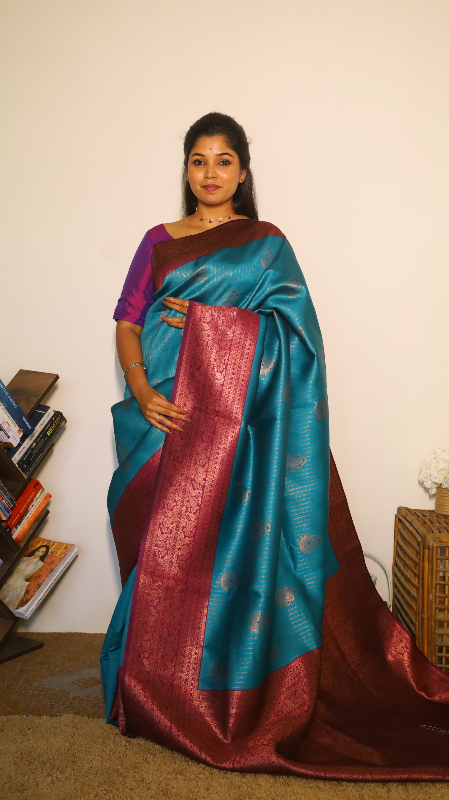 Luxurious semi soft silk saree in peacock green and purple border with gold zari - AVANTHIKA