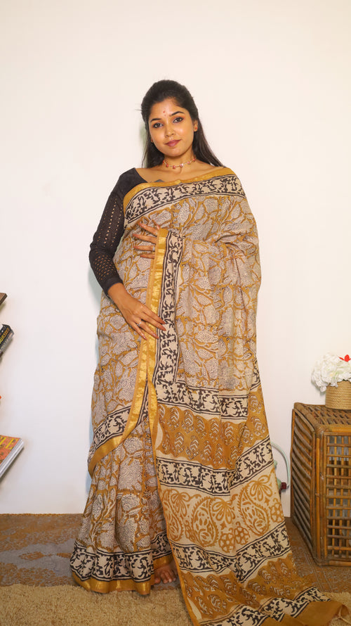 Artistic soft cotton kalamkari saree in mustard prints and handprinted pallu - BOOMIKA