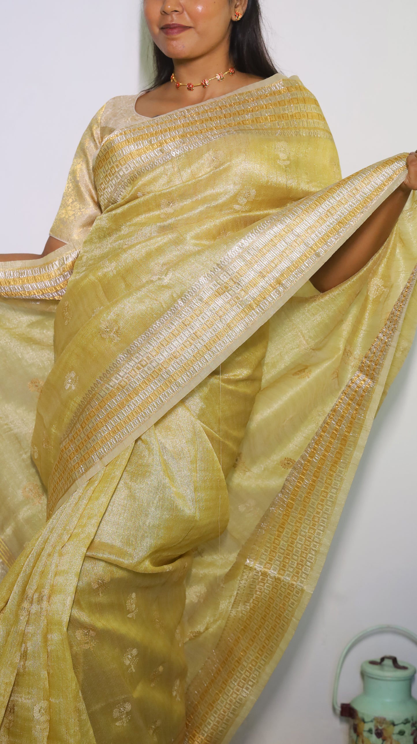 Exquisite semi silk saree in gold all over body and elegant border with subtle silver woven butta - Shruthika