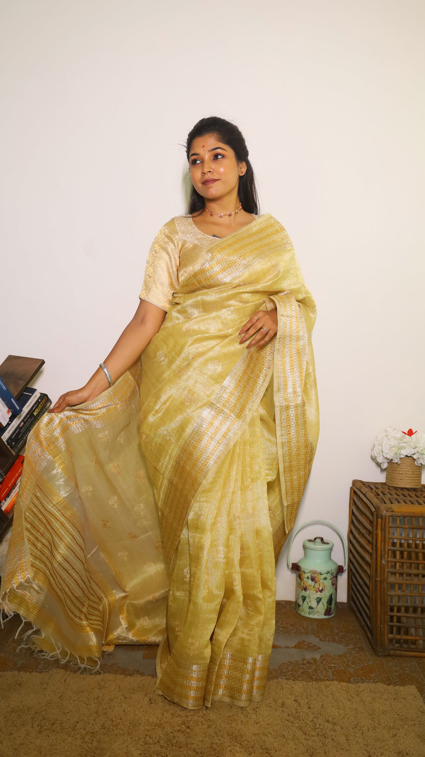 Exquisite semi silk saree in gold all over body and elegant border with subtle silver woven butta - Shruthika