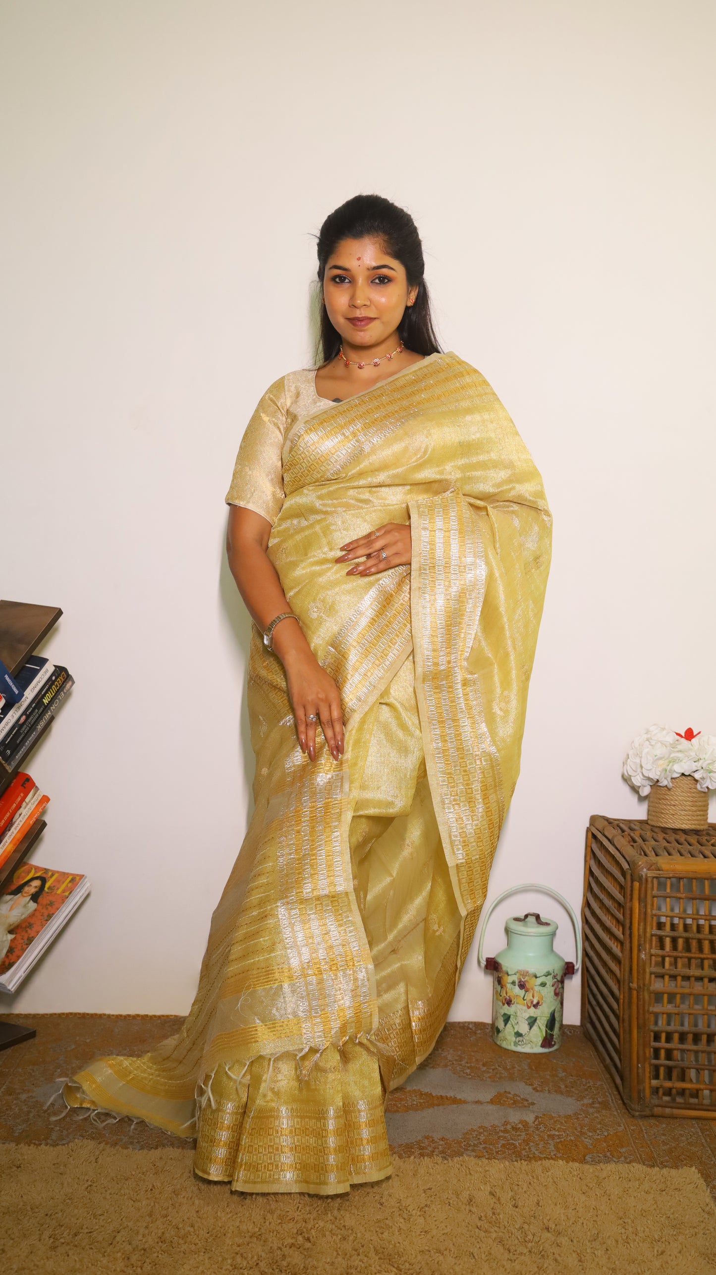 Exquisite semi silk saree in gold all over body and elegant border with subtle silver woven butta - Shruthika