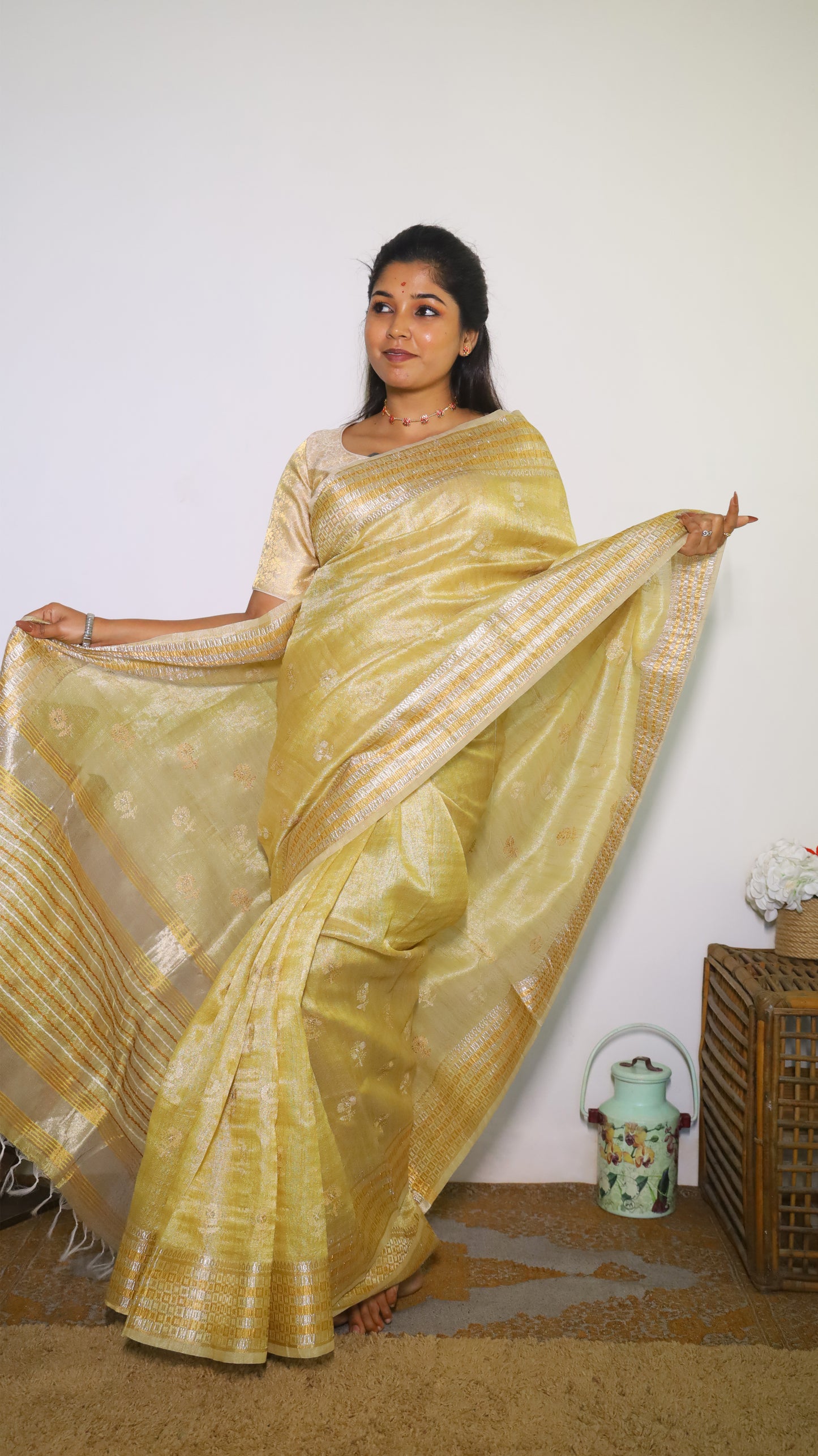 Exquisite semi silk saree in gold all over body and elegant border with subtle silver woven butta - Shruthika