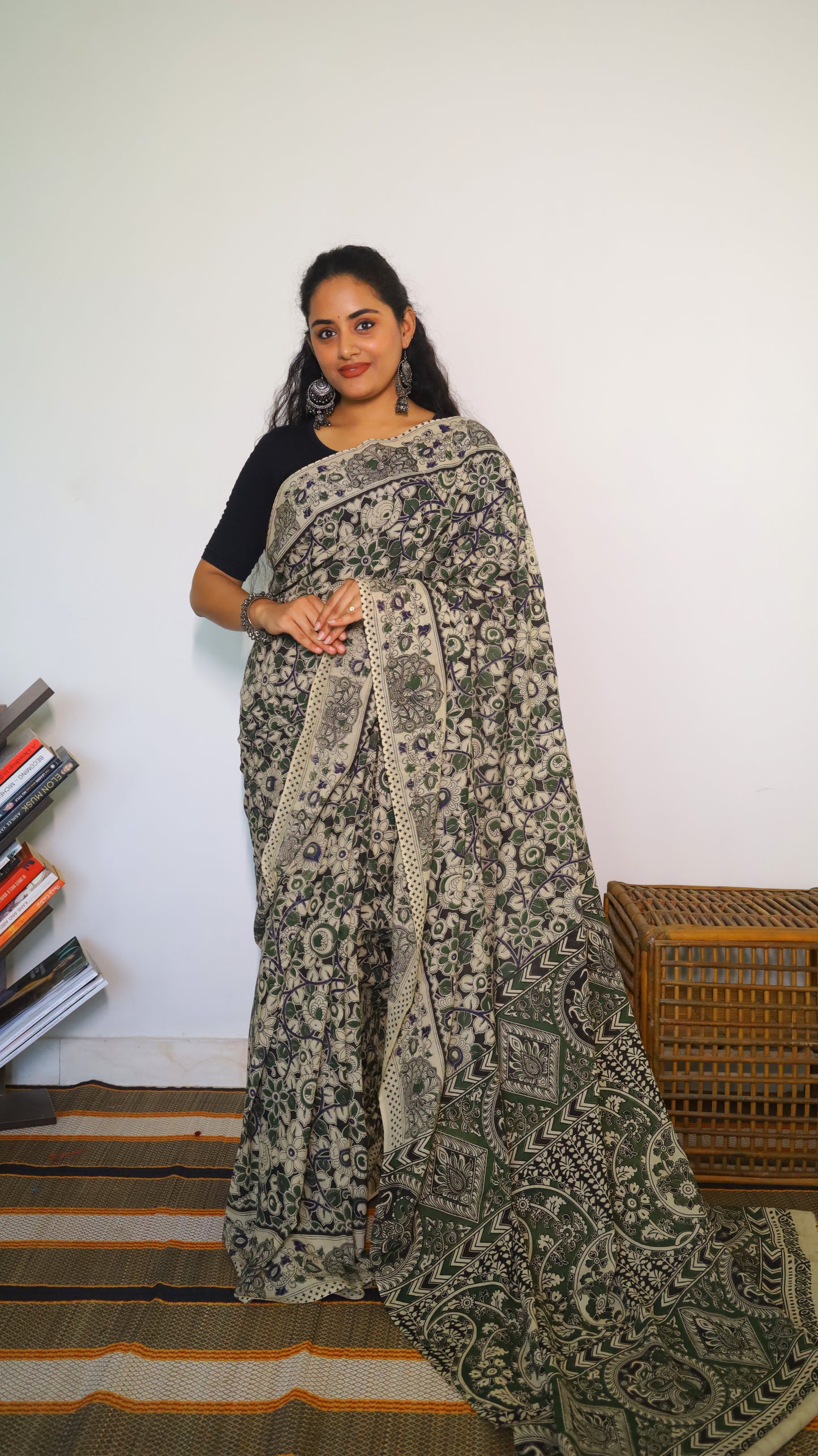 Artisanal black base kalamkari cotton saree with delicate beige, green and blue motifs blossoming - BOOMIKA