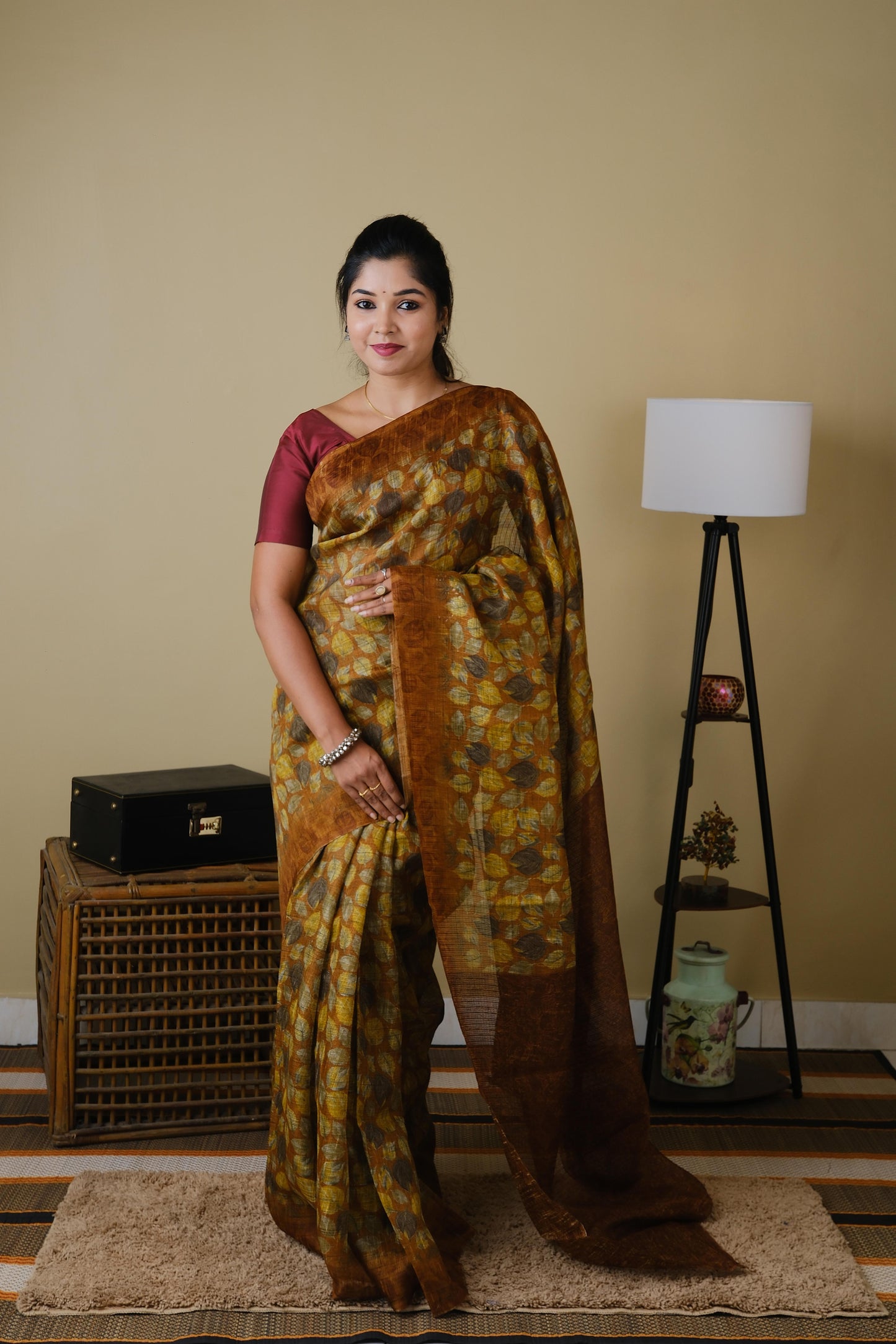 Jute cotton in brown with falling leaves pattern and brown border - BOOMIKA