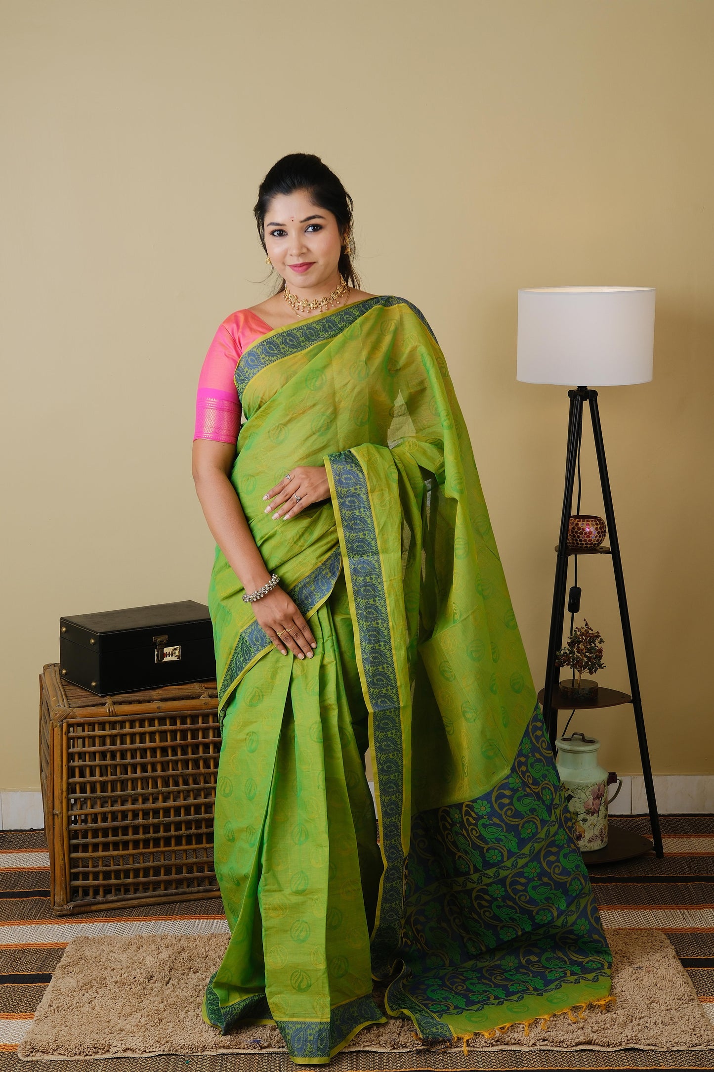 Handloom cotton in parrot green double shot with blue leaf border - BOOMIKA