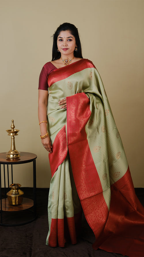 Soft silk brocade in pistha green with vairaoosi and gold motif body and chilli red contrast pallu with double zari border - AVANTHIKA (20009007)