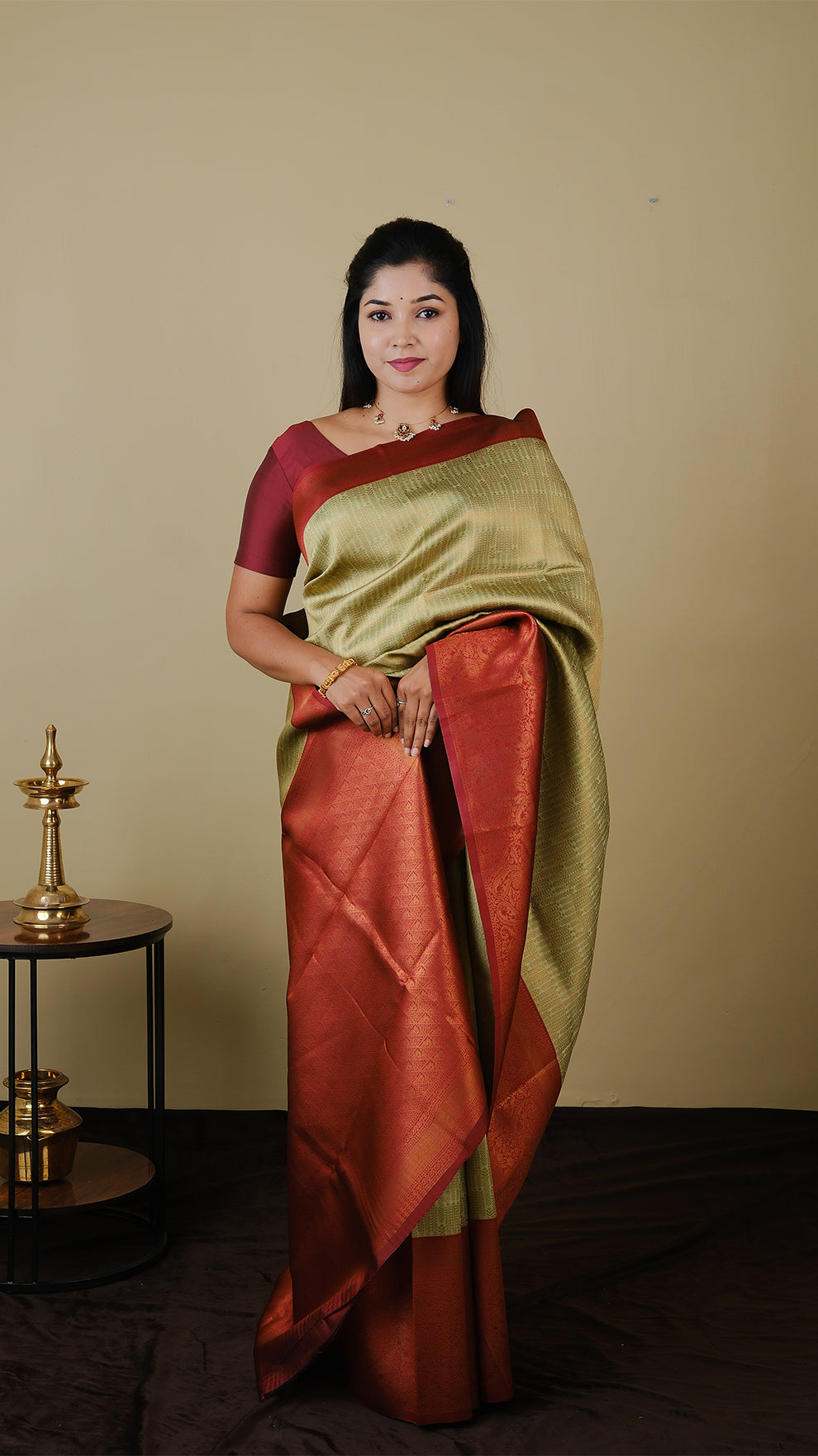 Soft silk brocade in pistha green with all over jal gold zari and gold motif body and chilli red contrast pallu with double border - AVANTHIKA (20009011)