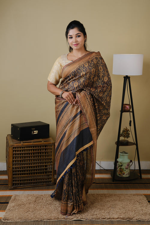 Soft cotton in black with golden tribal prints and pinkish brown border - BOOMIKA