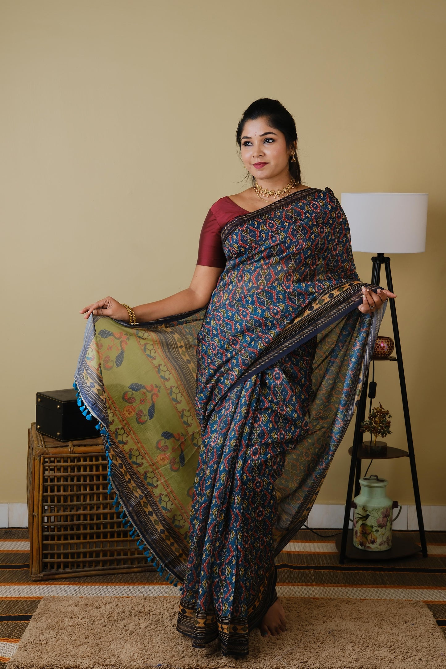Soft cotton in teal green with patolla print and black border - BOOMIKA