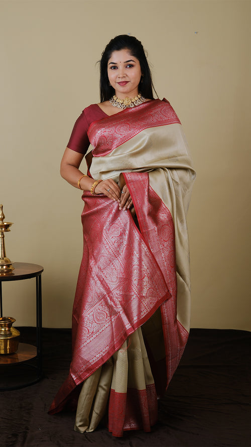 Mango silk brocade in deep cream with vairaoosi and silver motif body with blood red contrast pallu and double silver zari border - AVANTHIKA (20009023)