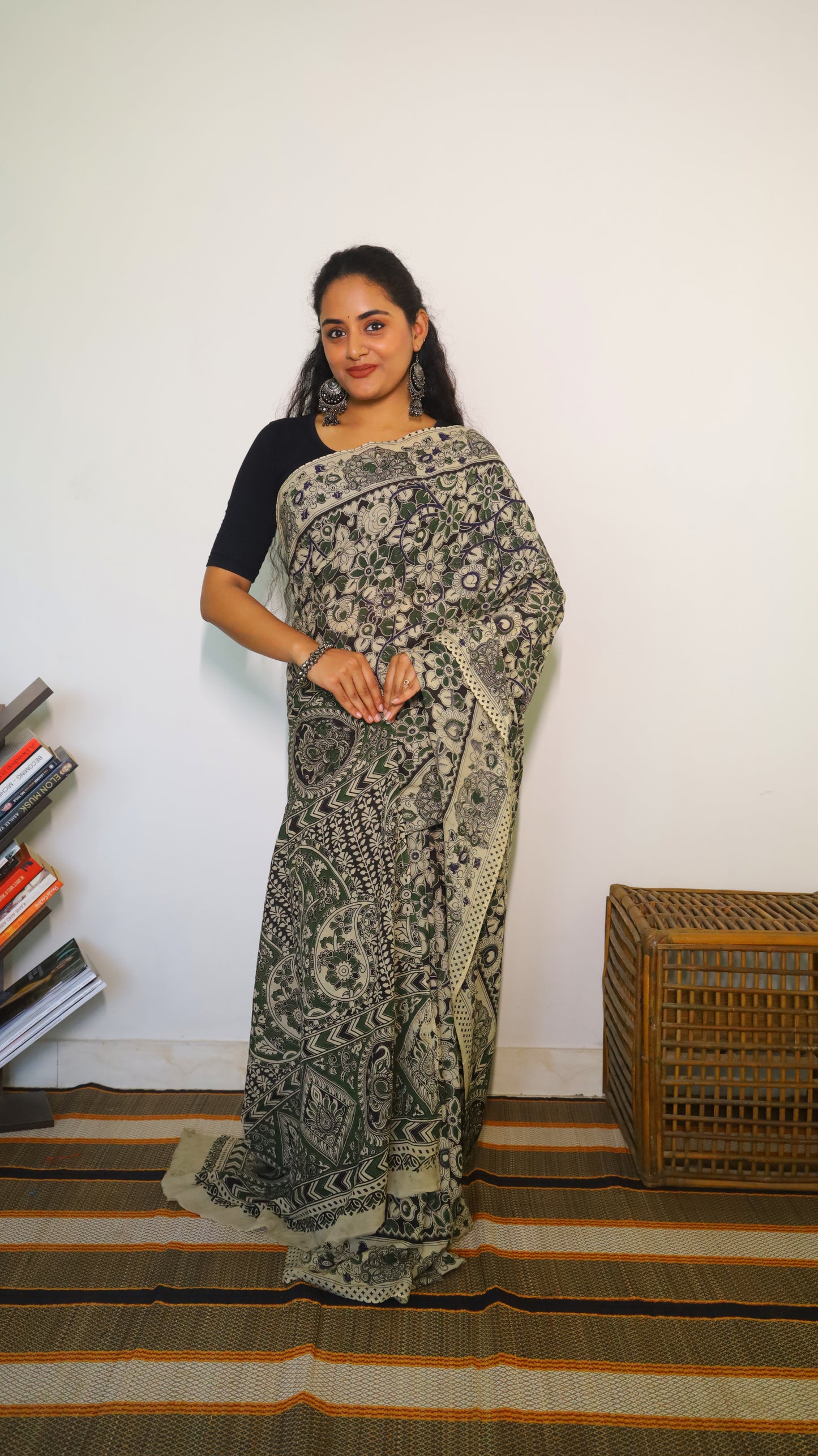 Artisanal black base kalamkari cotton saree with delicate beige, green and blue motifs blossoming - BOOMIKA