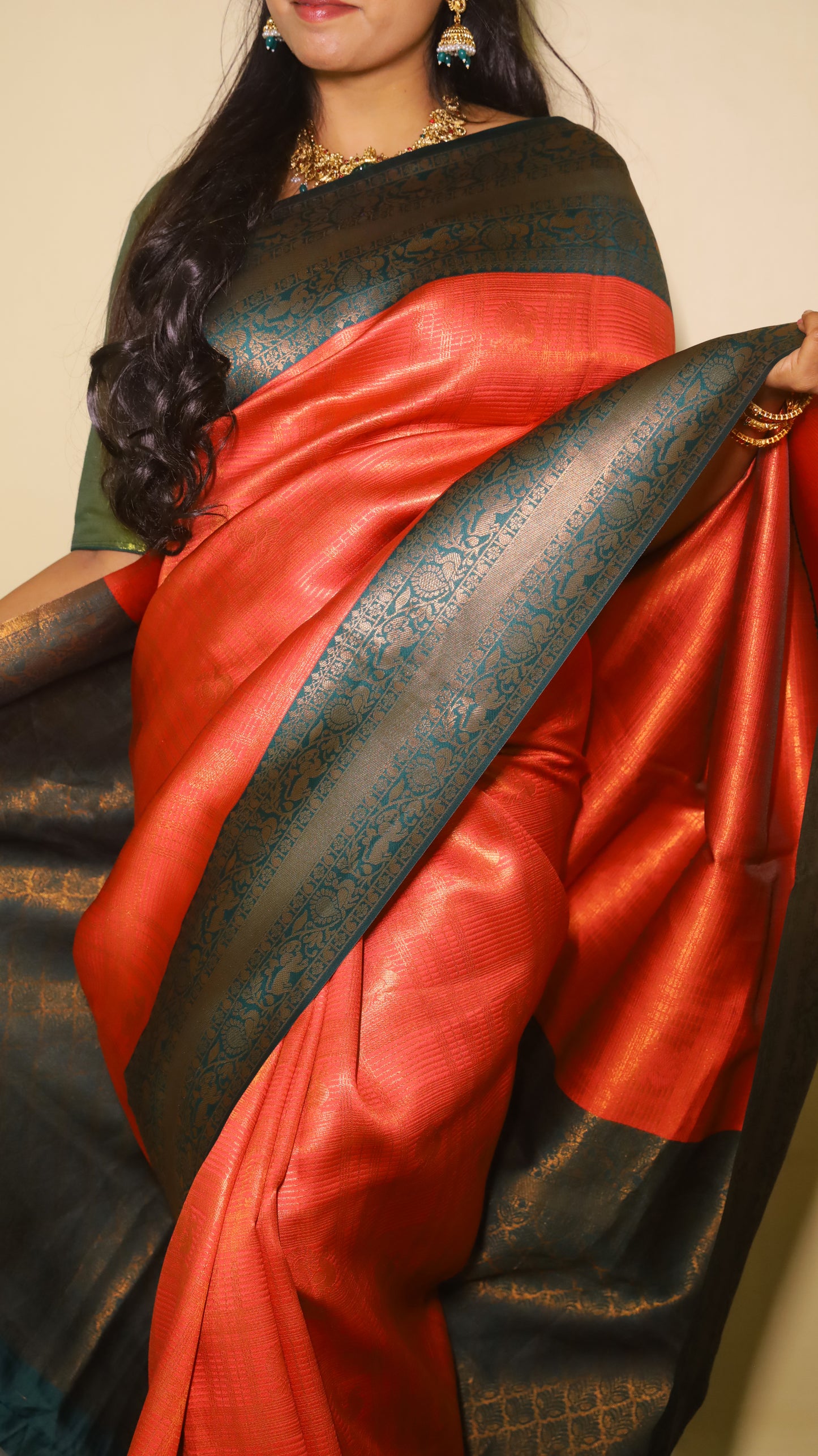 Luxurious soft silk red tissue saree with self imprint and bottle green border with gold zari - AVANTHIKA