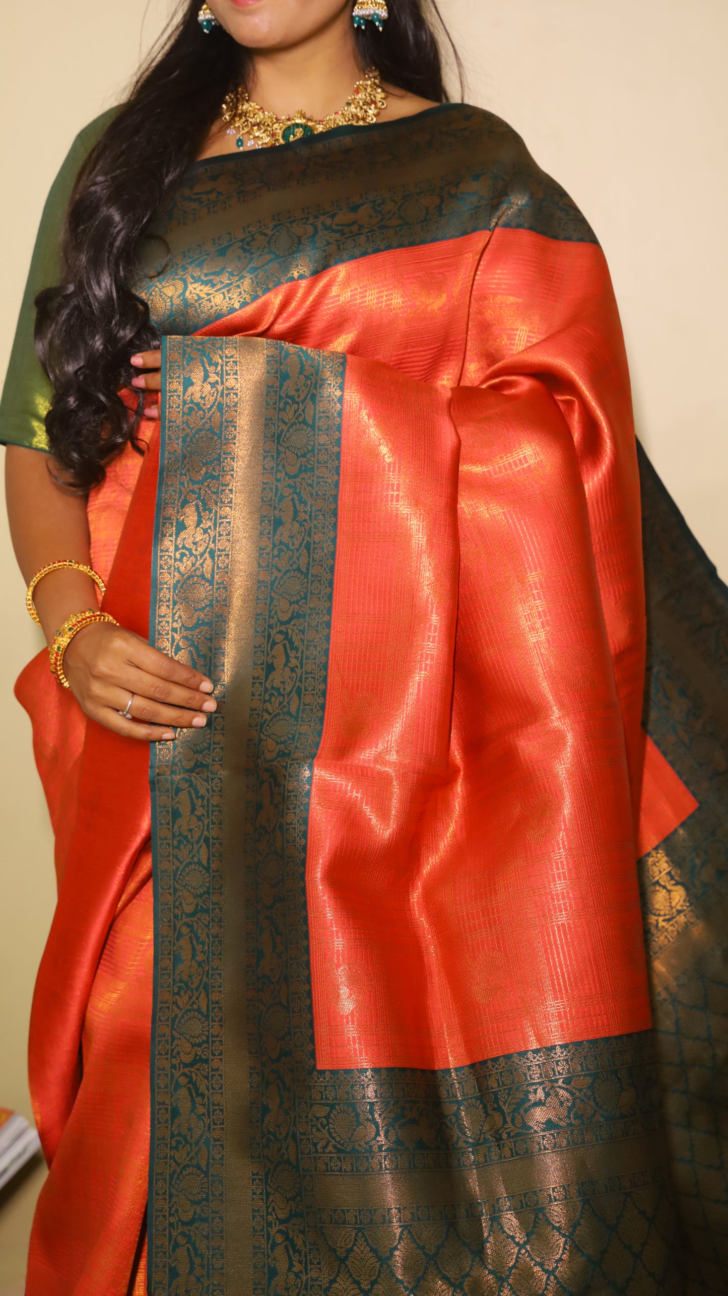 Luxurious soft silk red tissue saree with self imprint and bottle green border with gold zari - AVANTHIKA