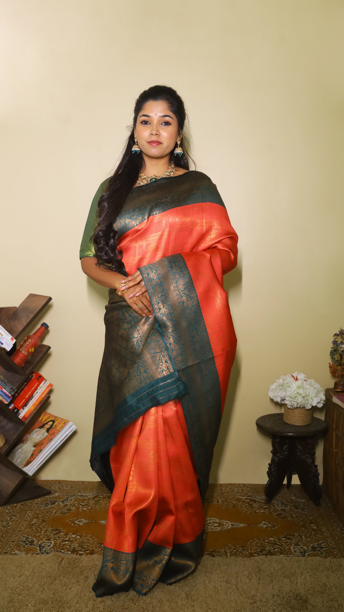 Luxurious soft silk red tissue saree with self imprint and bottle green border with gold zari - AVANTHIKA