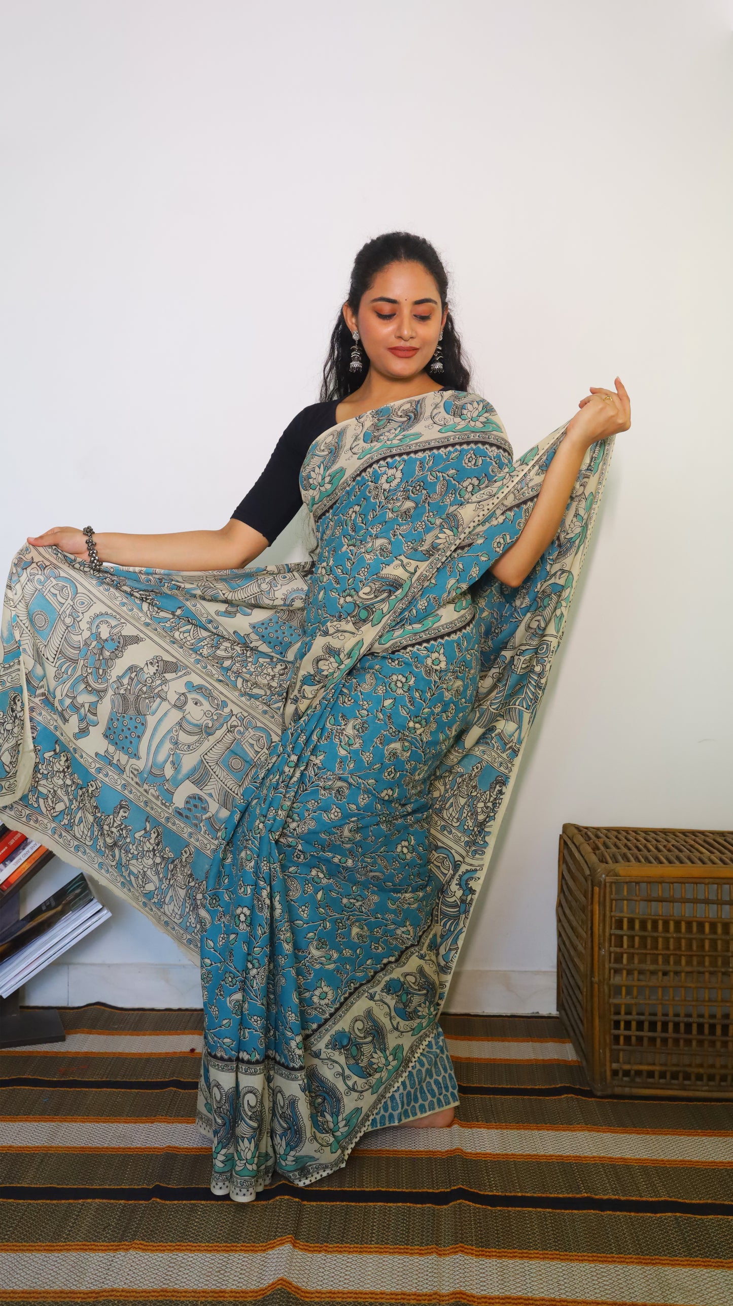 Featherlight teal blue cotton kalamkari saree featuring floral and paisley motifs - BOOMIKA