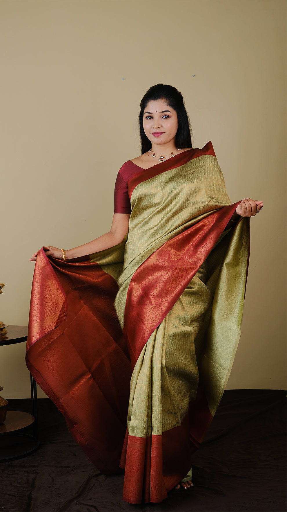 Soft silk brocade in pistha green with all over jal gold zari and gold motif body and chilli red contrast pallu with double border - AVANTHIKA (20009011)