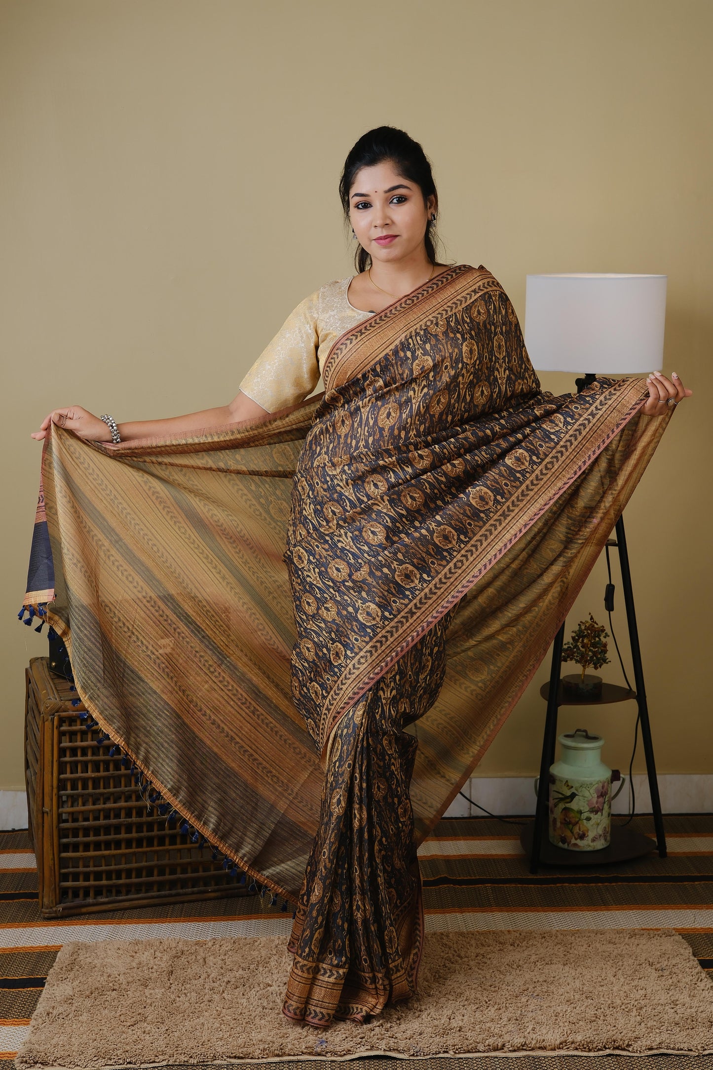 Soft cotton in black with golden tribal prints and pinkish brown border - BOOMIKA