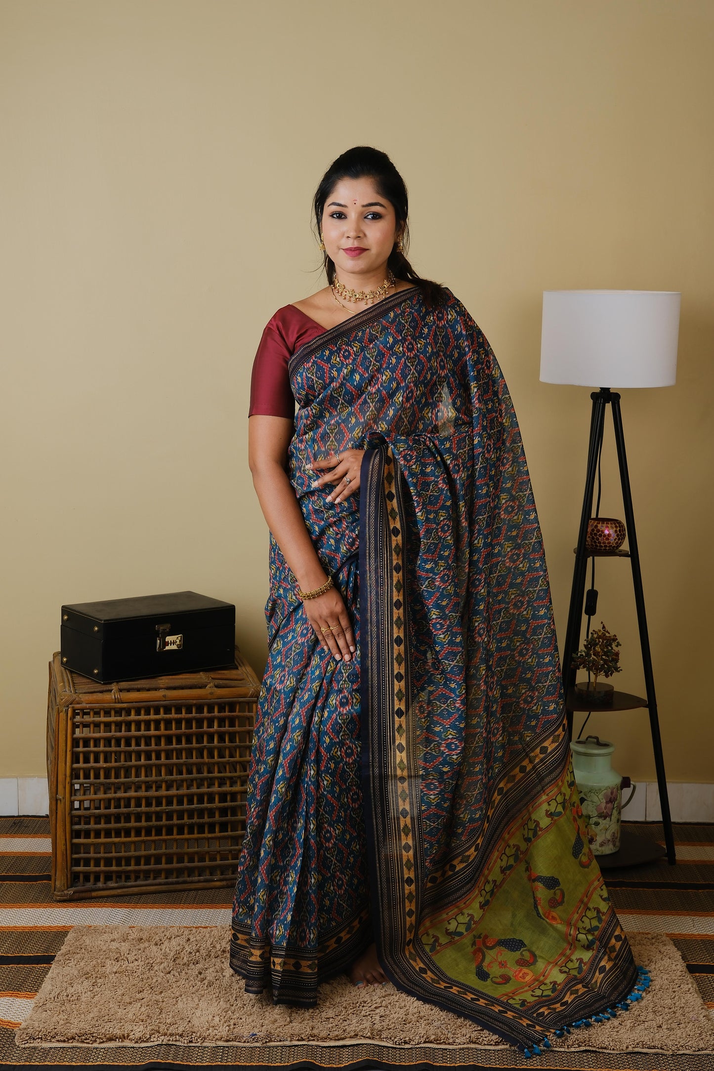 Soft cotton in teal green with patolla print and black border - BOOMIKA