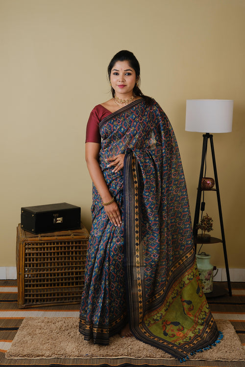 Soft cotton in teal green with patolla print and black border - BOOMIKA