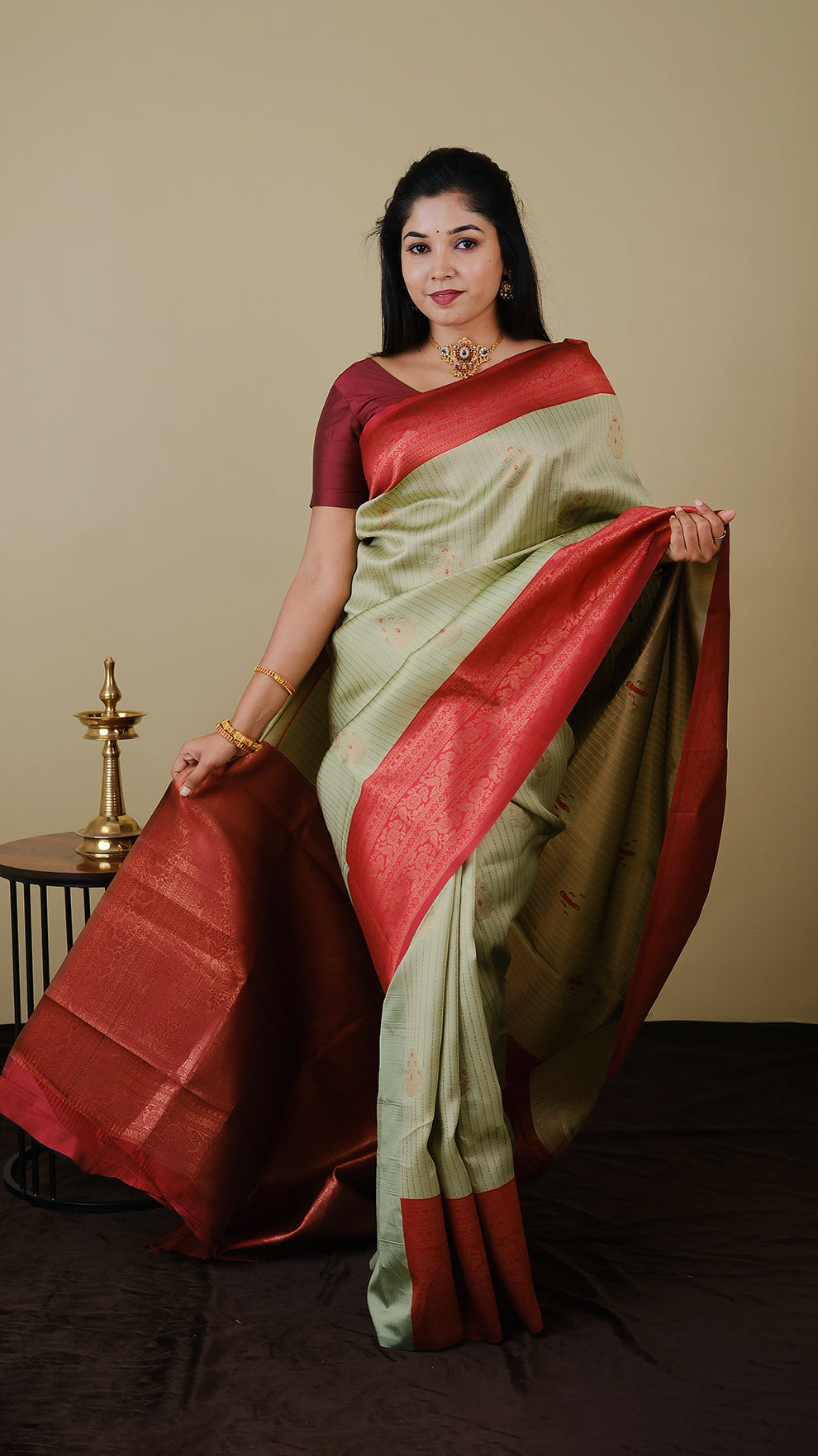 Soft silk brocade in pistha green with vairaoosi and gold motif body and chilli red contrast pallu with double zari border - AVANTHIKA (20009007)