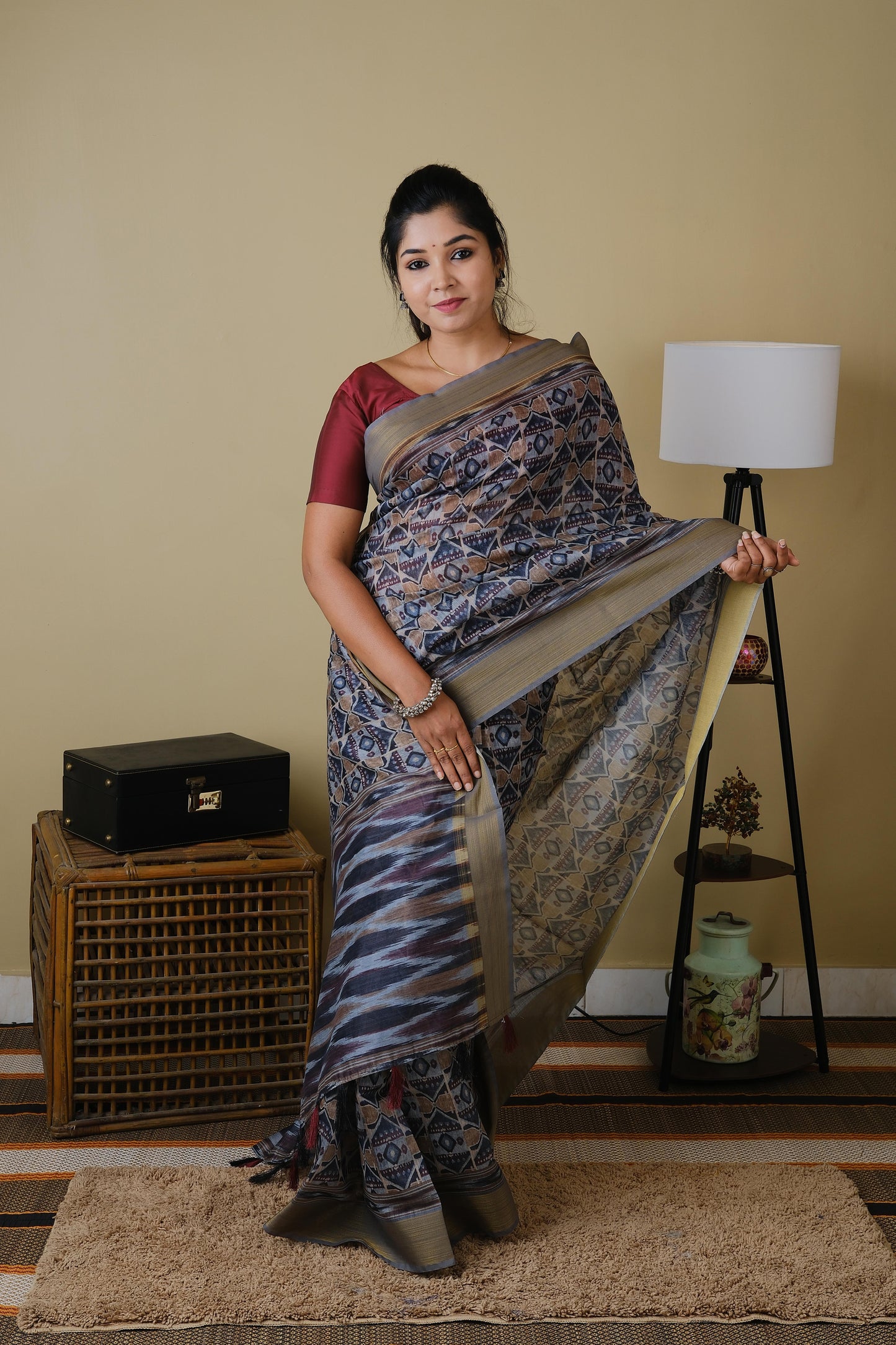 Soft cotton in light grey with all over tribal print and self zari border - BOOMIKA