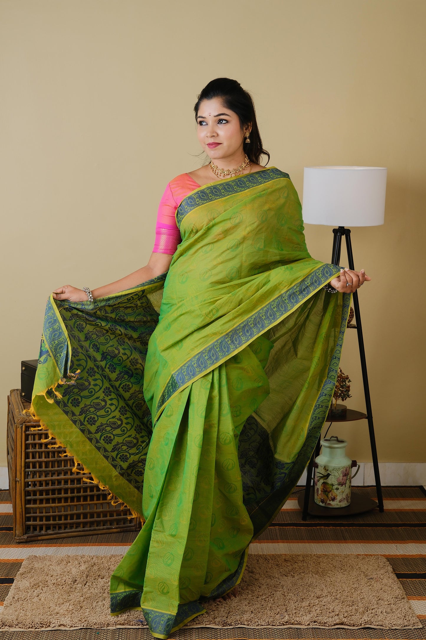Handloom cotton in parrot green double shot with blue leaf border - BOOMIKA