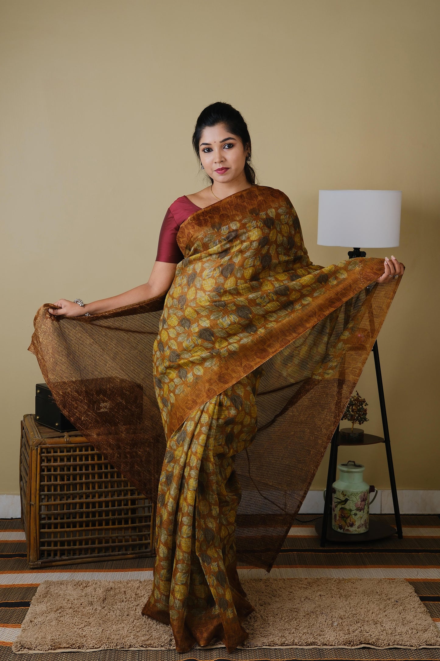 Jute cotton in brown with falling leaves pattern and brown border - BOOMIKA