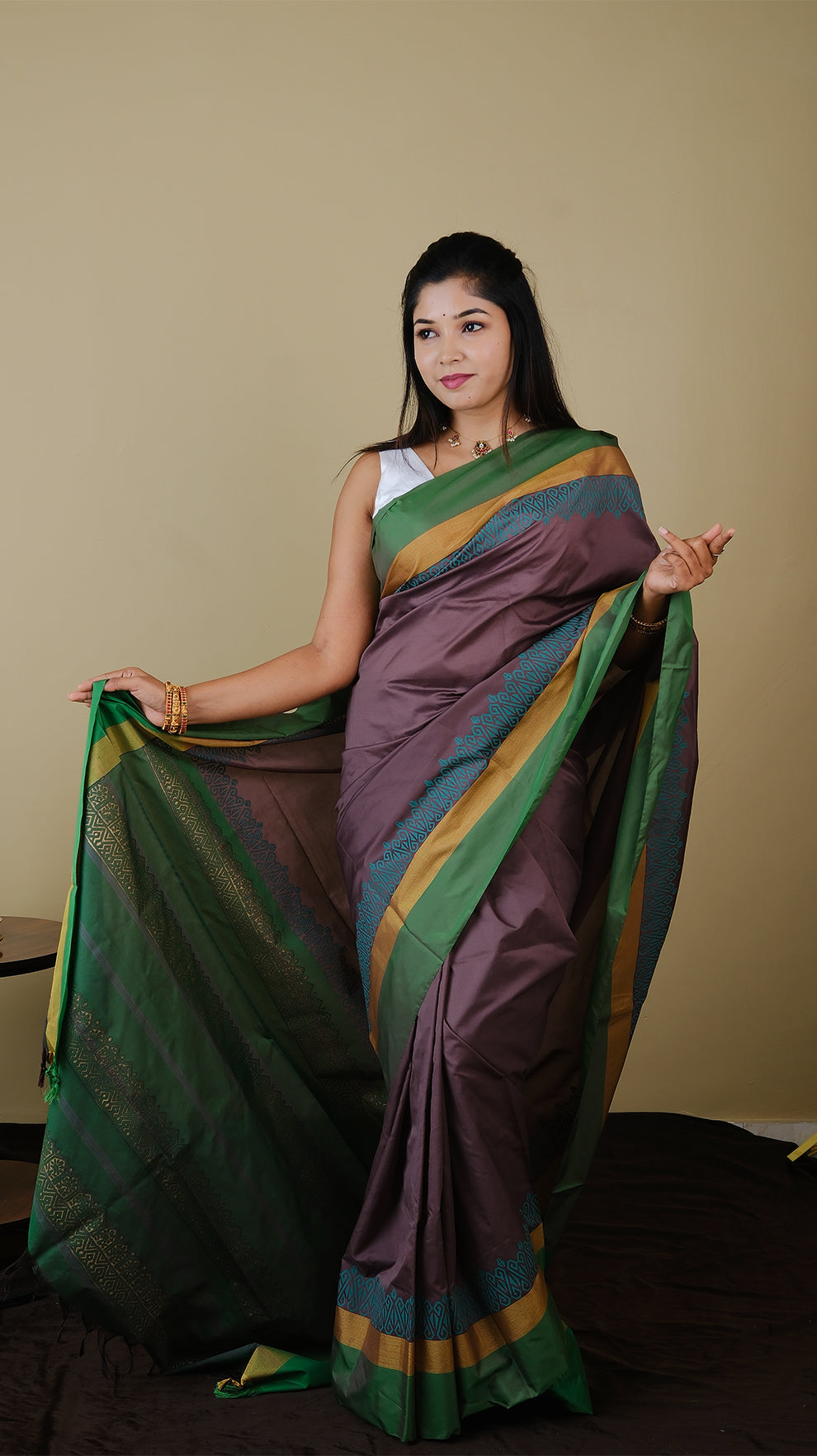 Soft silk saree in purplish brown and sea green block print with simple border in gold zari and parrot green - AVANTHIKA (20014003)