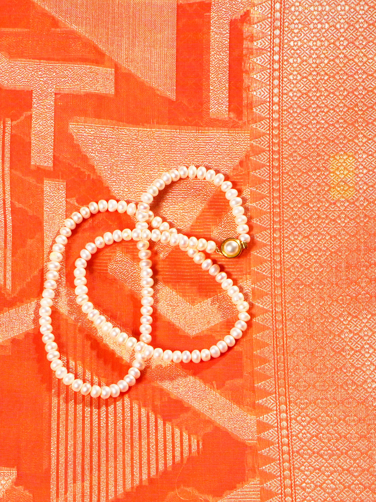 Manipuri cotton in peach orange with all over cream abstract and double border - KRITHIKA (30001005)