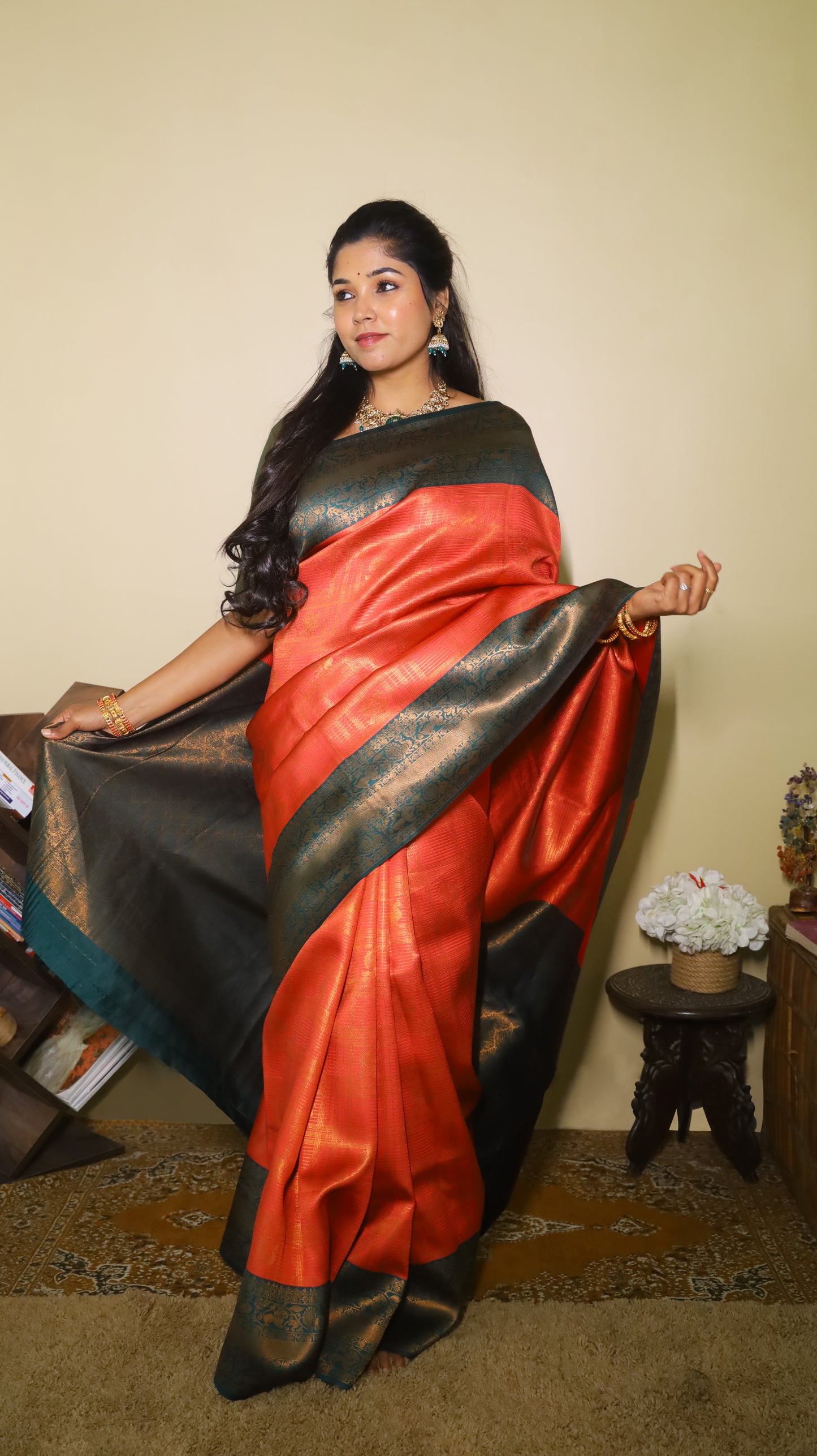Luxurious soft silk red tissue saree with self imprint and bottle green border with gold zari - AVANTHIKA