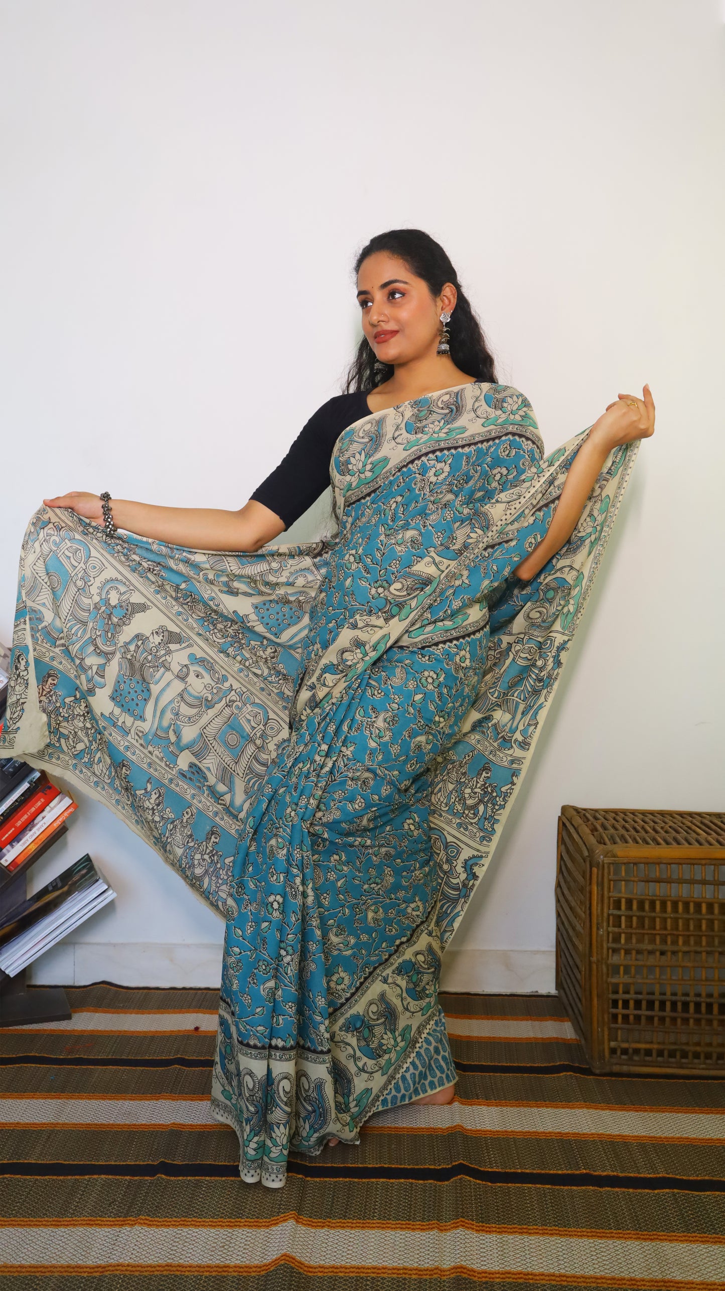 Featherlight teal blue cotton kalamkari saree featuring floral and paisley motifs - BOOMIKA