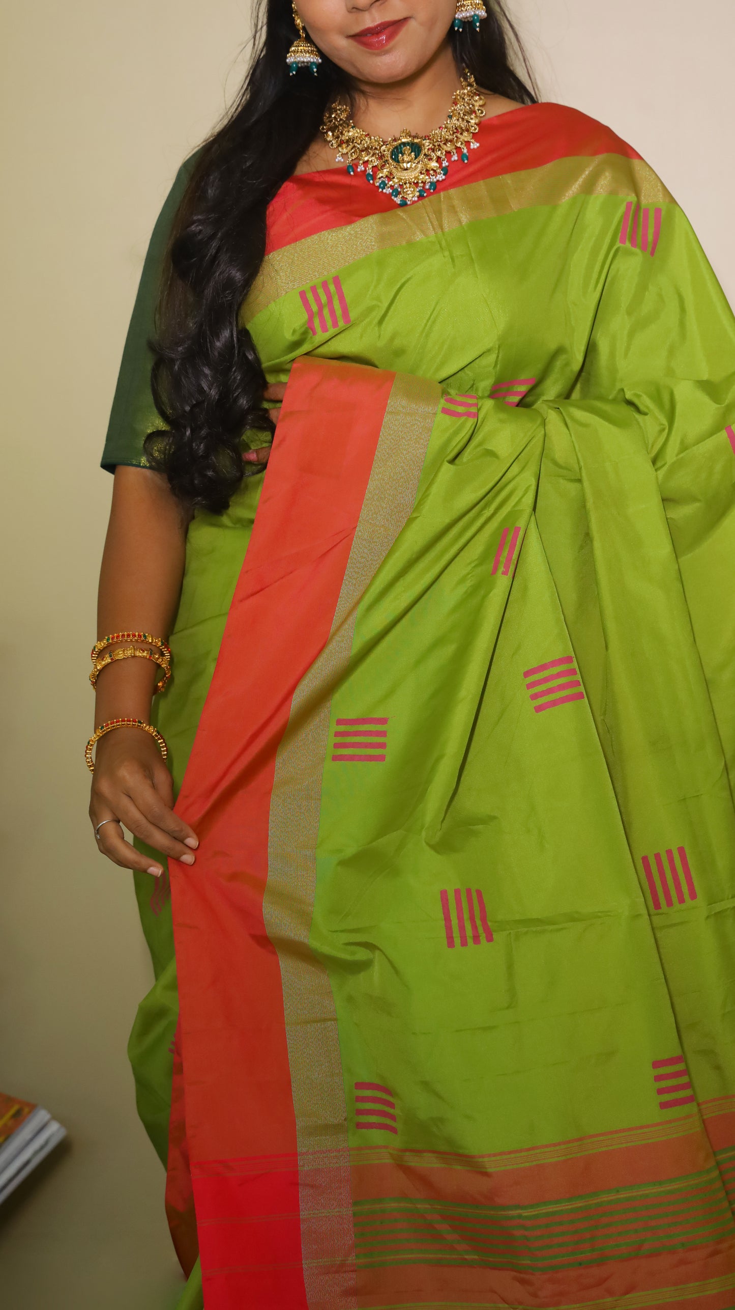 Elegant light green Pasmina silk saree adorned with delicate pink woven motifs, and contrasting pink-gold border - AVANTHIKA